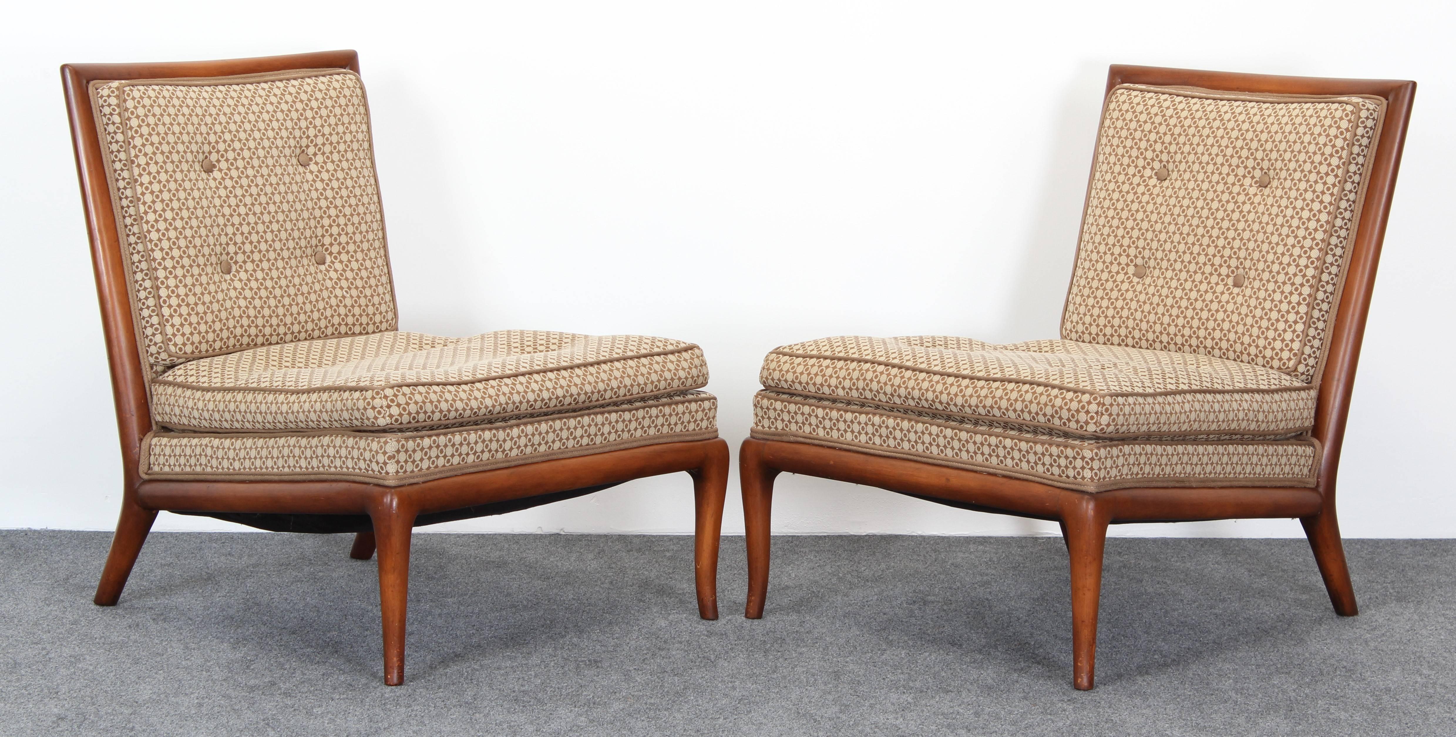 A elegant pair of T.H. Robsjohn-Gibbings slipper chairs. Upholstery and wood are in good condition with age appropriate wear as shown in images. Slight hair line to wood but can be filled easilly when refinishing and upholstering. Structurally sound.