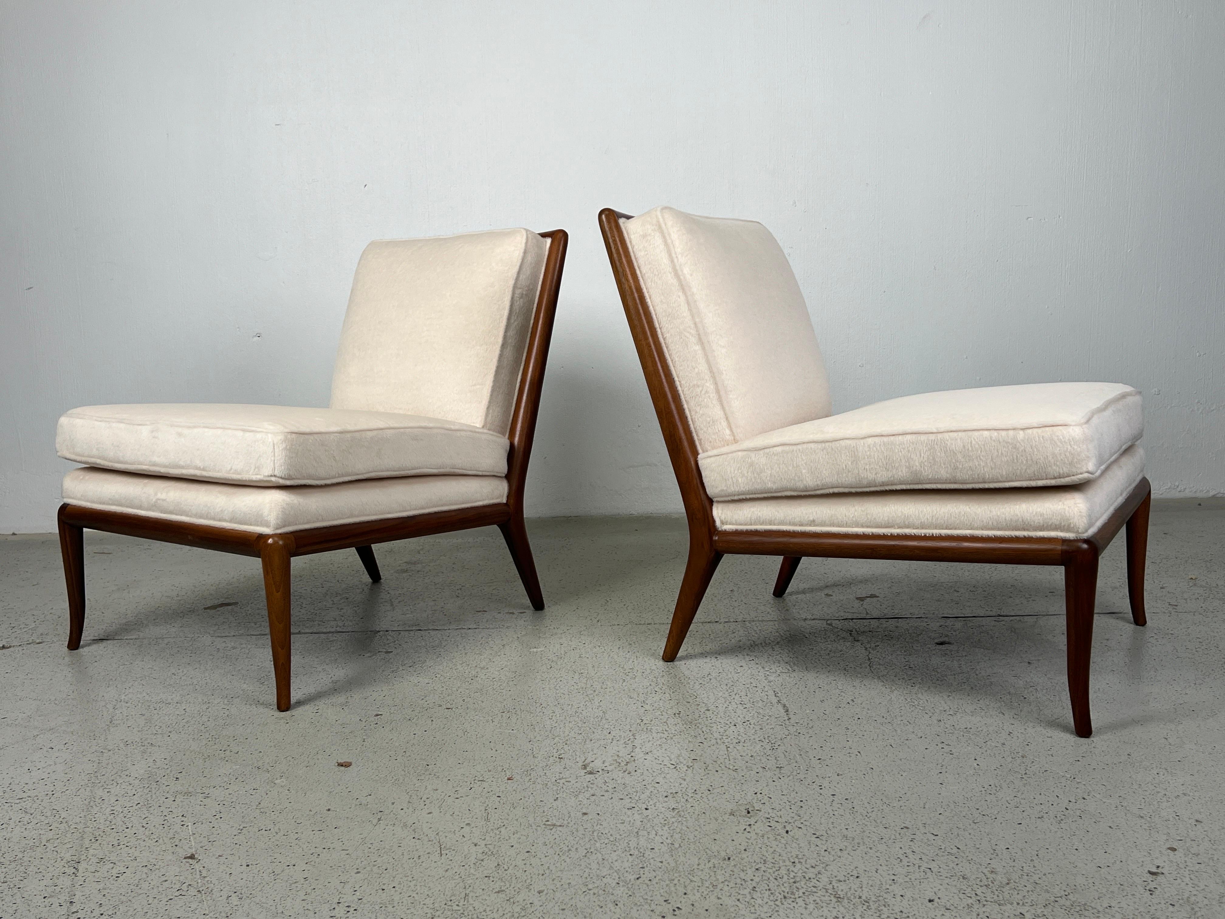 A pair of slipper chairs designed by T.H. Robsjohn-Gibbings for Widdicomb reupholstered in  Holly Hunt / Royal Alpaca / Angora. 