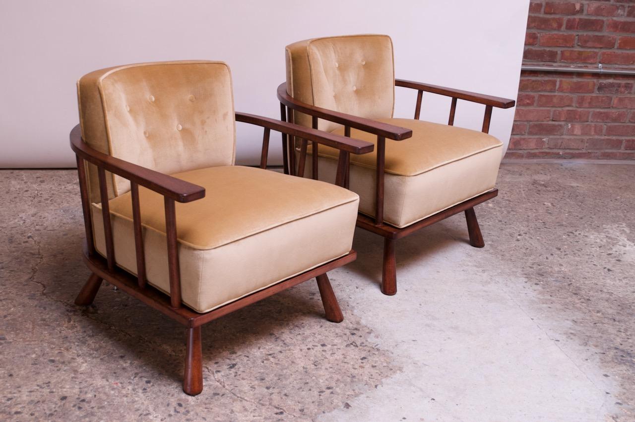 Pair of Robsjohn-Gibbings for Widdicomb walnut lounge chairs (model #1682, circa 1957 USA). Spindle-constructed frame with a barrel-back form supported by sculptural, flared legs. Velvet features a button-tufted back and piped trim.
Newly
