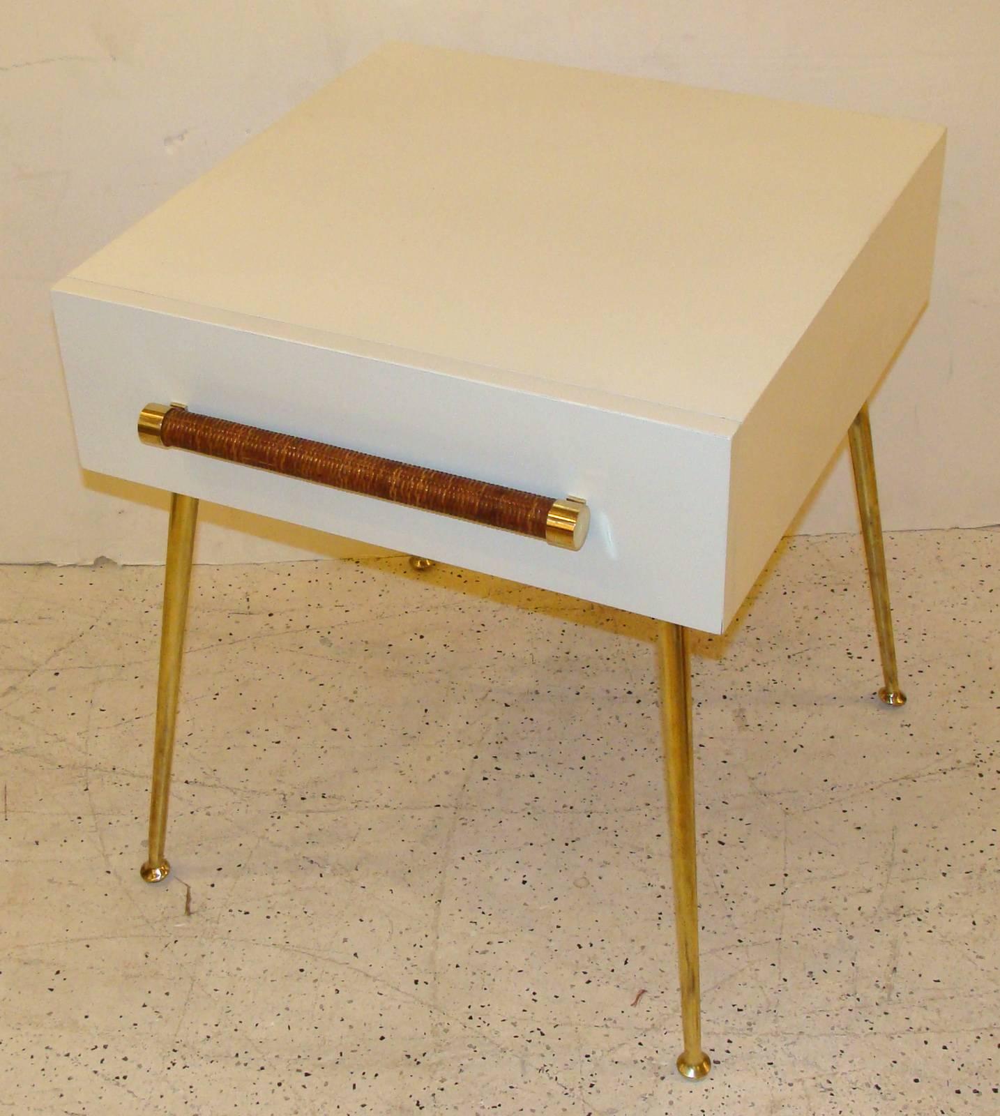 Assembled pair of end or side tables. Also great as nightstands. Widdicomb model #4001.
One dated 1953, the other dated 1956. Full Robsjohn-Gibbings label in one table drawer, remnant label in the other. Original brass legs and cane-wrapped/brass