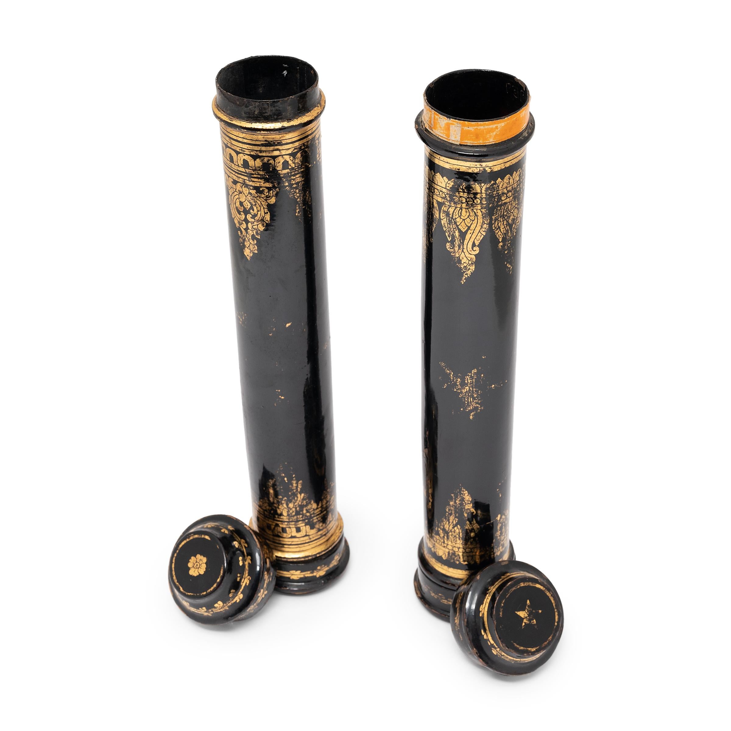 Made of bamboo and delicately lacquered in gold and black these early 20th century Thai scroll cases were an essential accessory for any esteemed scholar. The perfect size for a rolled-up scroll, the cases were once used to store and protect works