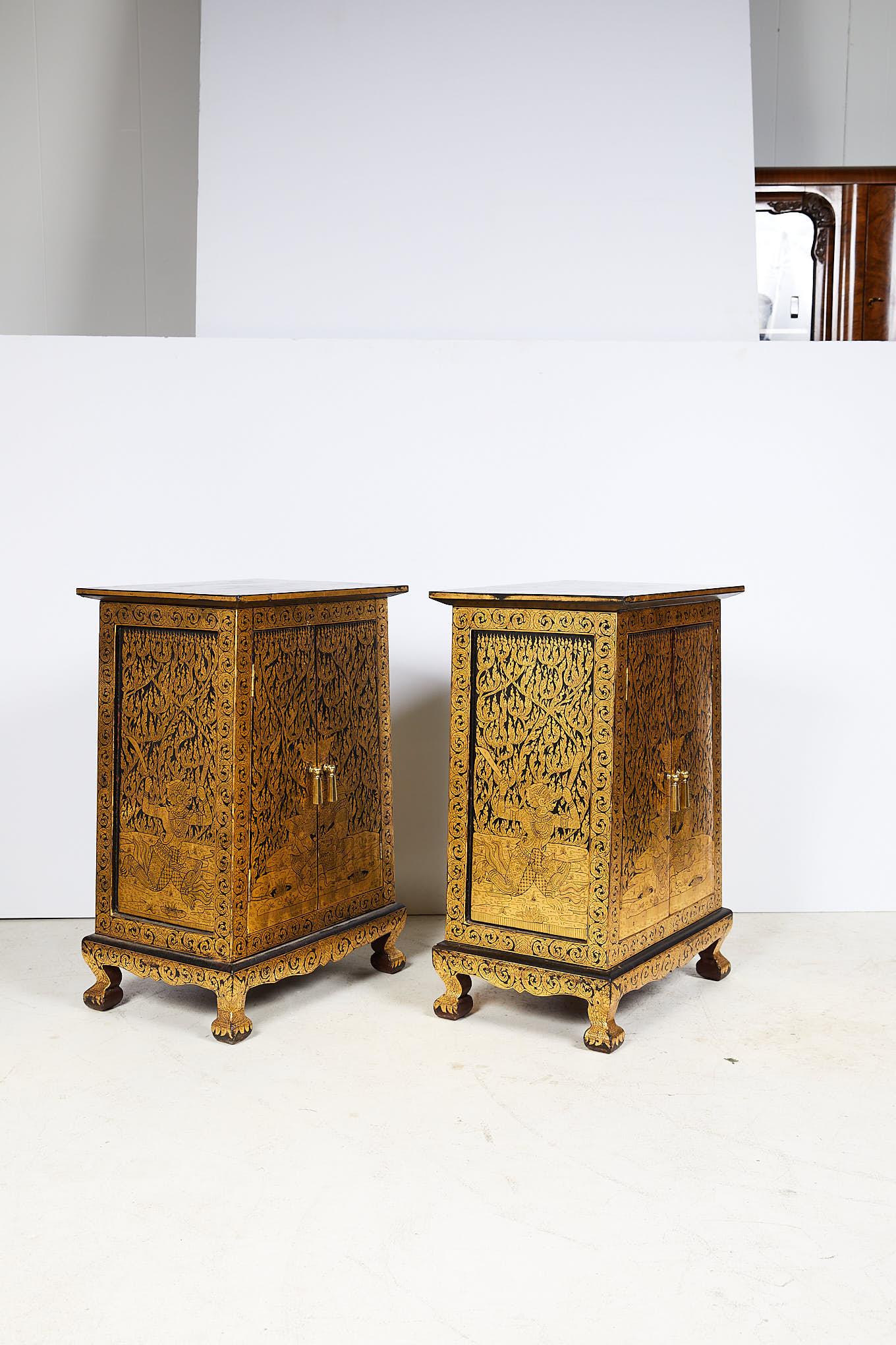 An elegant pair of mid 20th century Thai manuscript cabinets, with a tapered teak wood body and slightly cantilevered top, and finished in a beautiful gold leaf and black lacquer, an ancient technique of their craftsmen called Lai Rod Nam. Used to