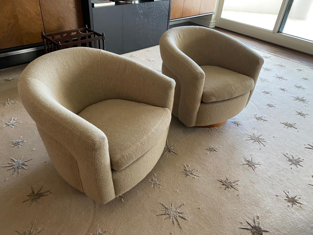 This pair of Thayer Coggin armchairs Swivels having the design of barrel in a neutral beige color From a Park Avenue Estate.