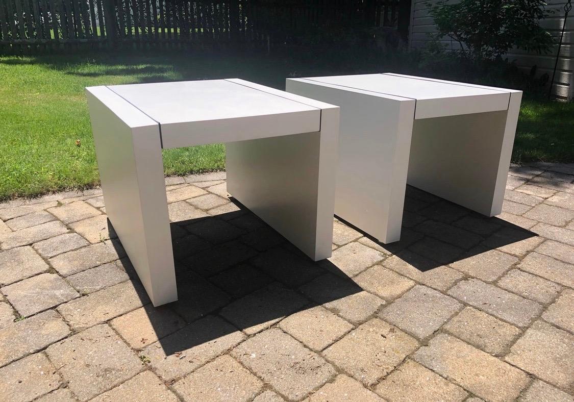 Parsons table that match from Thayer Coggin, circa 1970s. Features clean, white Formica with black trim design. Underneath, there is a heavy wooden frame. The tables are supported by four chrome feet at the base. Iconic, Minimalist design, clean