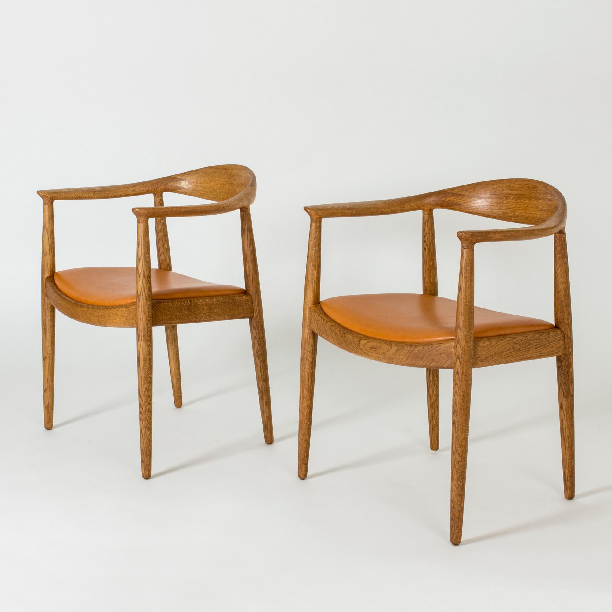Pair of beautiful oak and leather “The Chair” by Hans J. Wegner. Smooth wood with striking woodgrain.
“The Chair” was designed in 1949 and quickly became a huge success. The model was important in advocating Danish design internationally. Its