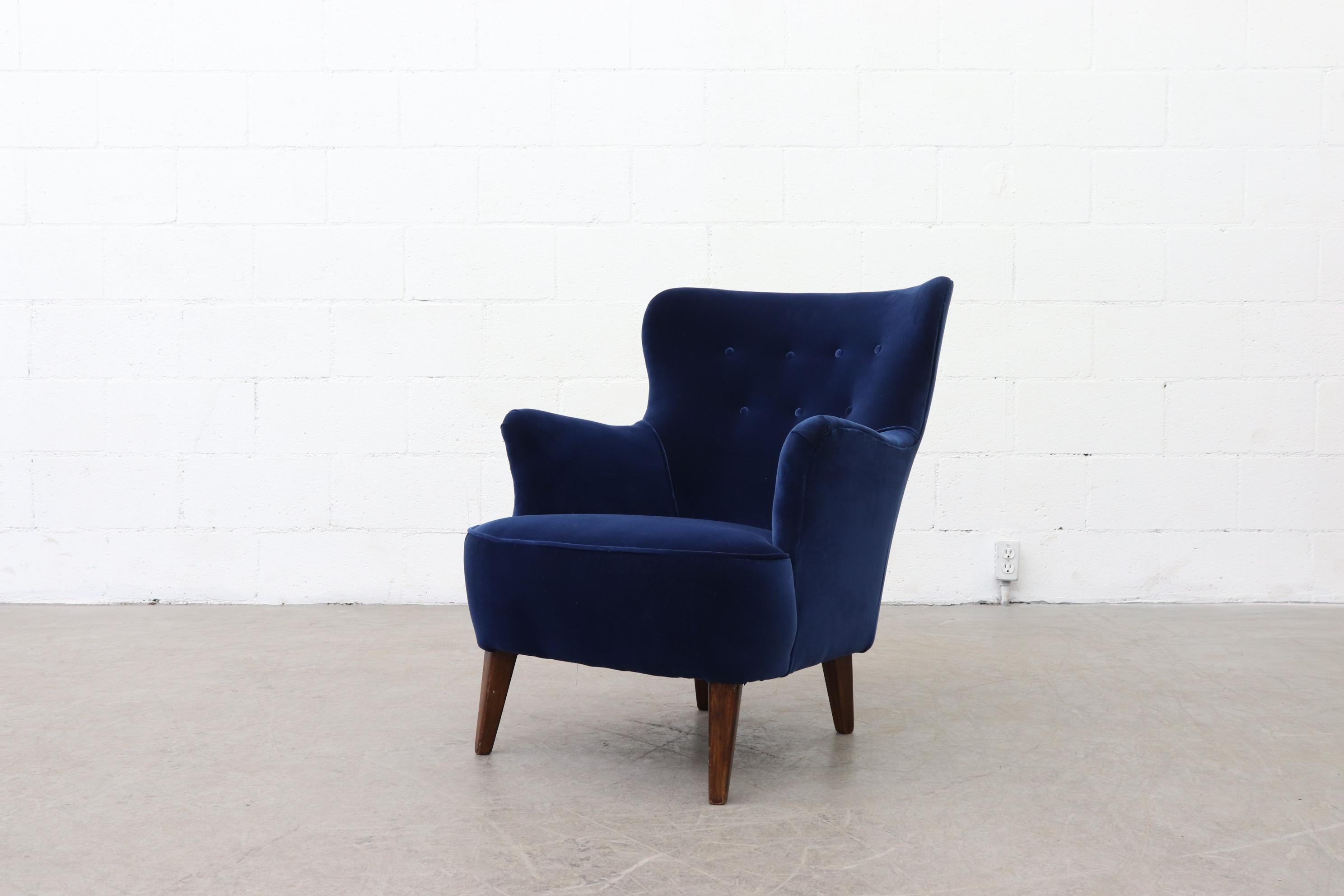 Pair of newly upholstered navy blue velvet Theo Ruth lounge chairs for Artifort. Legs in original condition with normal wear, consistent with their age and use. Pictured with matching loveseat, (LU922414479642) available and listed separately.
