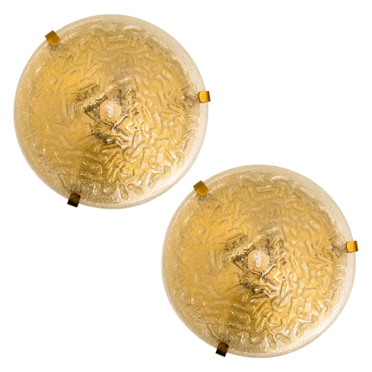 Clean lines to complement all decors. A pair of wonderful flush lights with brass detail and thick textured blown glass. Illuminates beautifully. 

Can also work for impressive wall lights. The stylish and clean elegance of this flushmounts suits