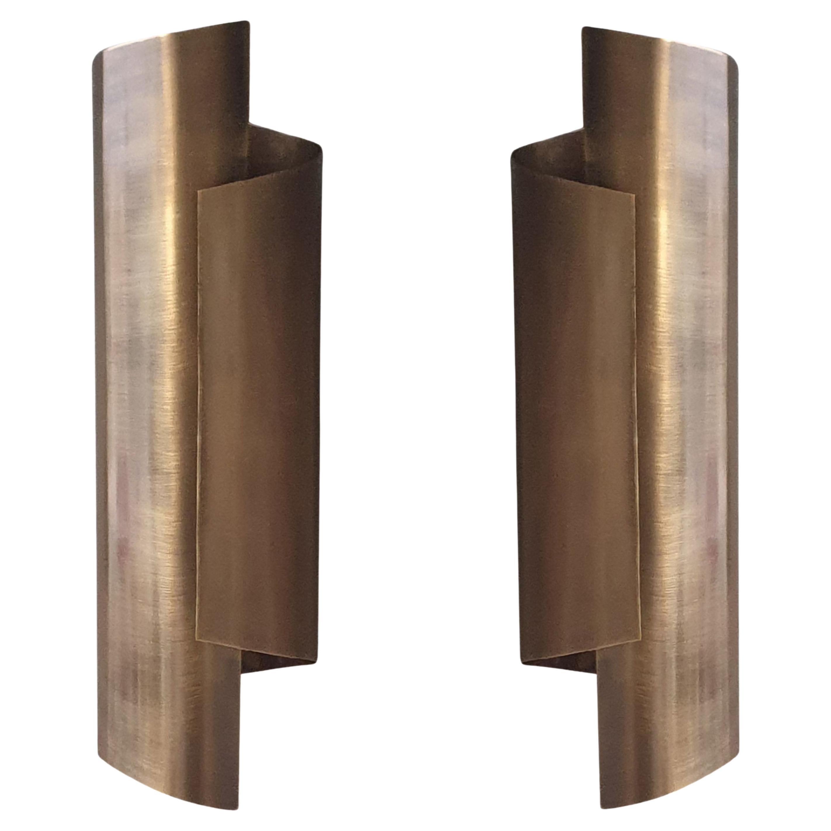 Pair of thick single sheet Brass Curve wall sconces in Antique Brass For Sale