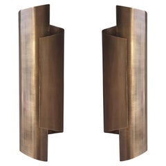 Pair of thick single sheet Brass Curve wall sconces in Antique Brass