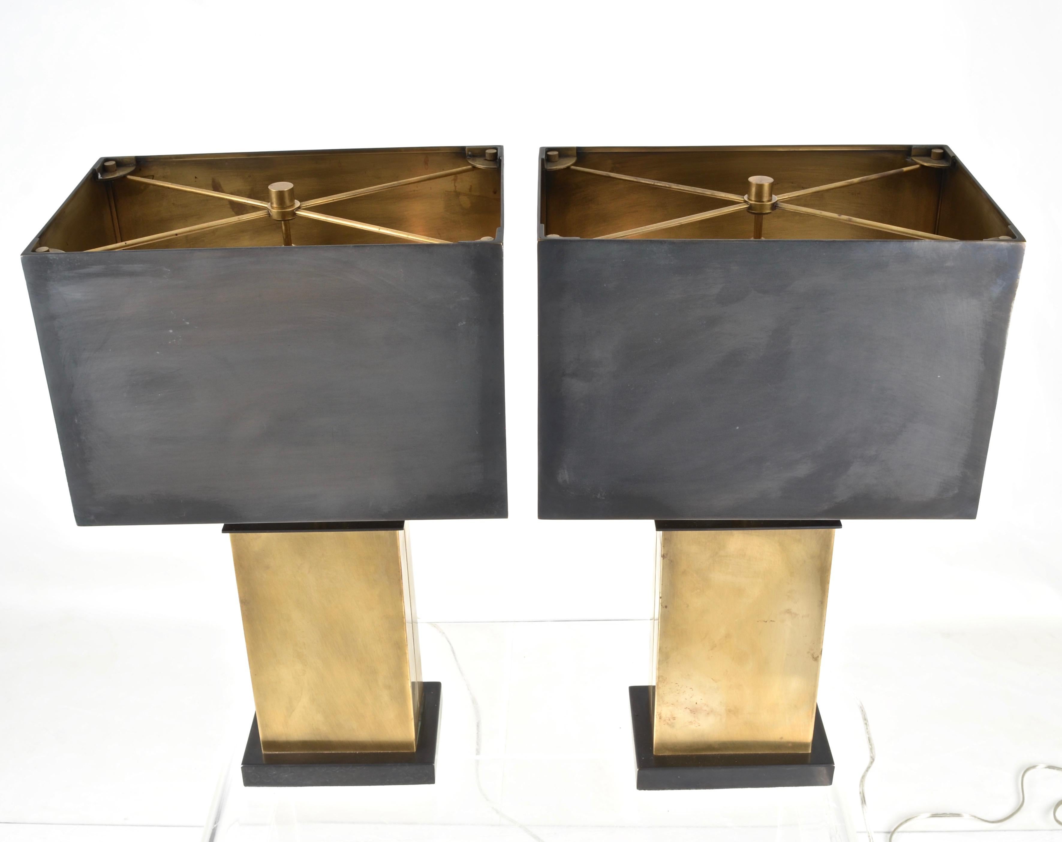 A striking design by noted designer Thomas O'Brien for Visual Comfort & Company Lighting. This pair is in a hand-rubbed antique brass finish with dark bronze finish shades with polished brass interiors. Two socket lamp, each socket takes a 60 watt
