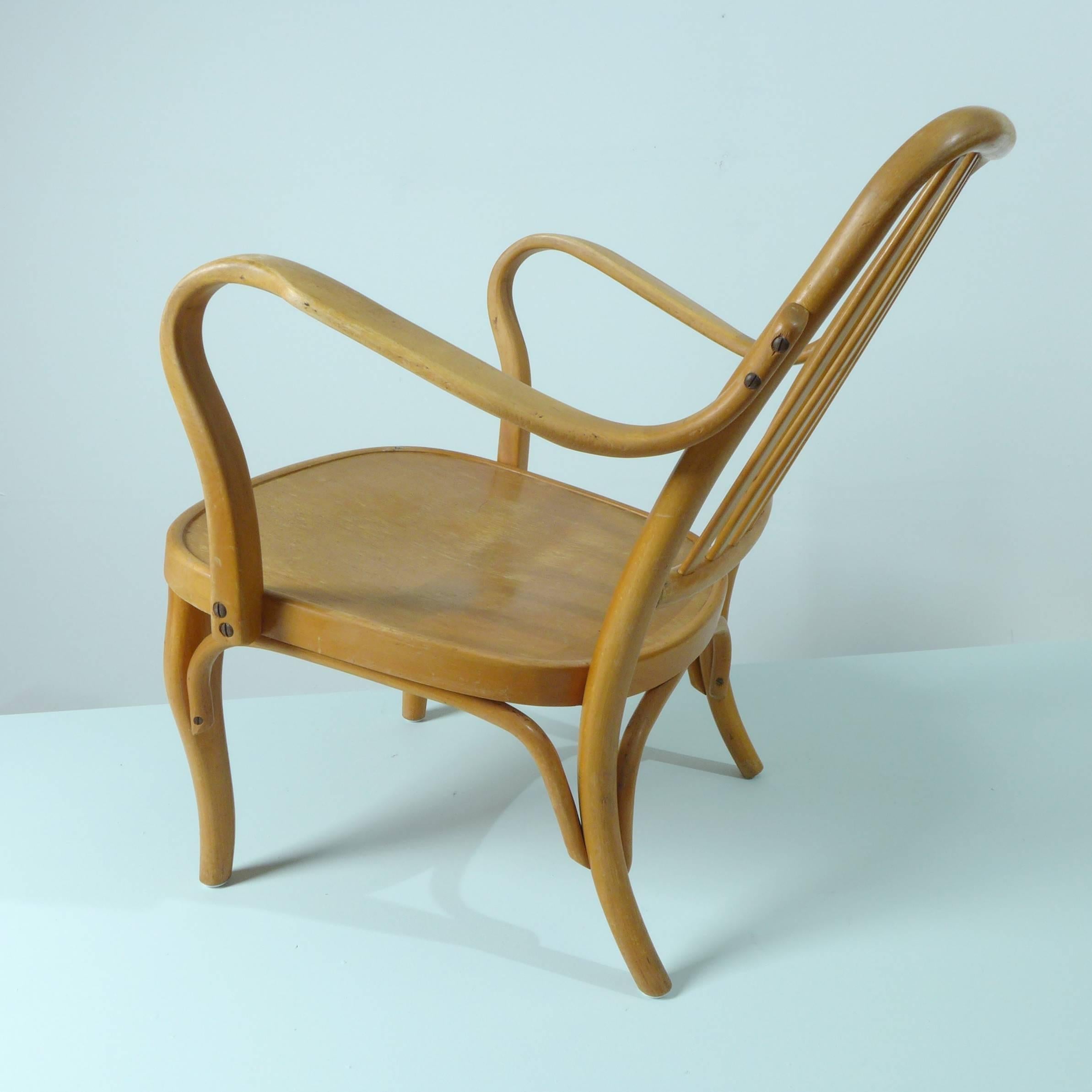 A pair of bent beechwood armchairs 