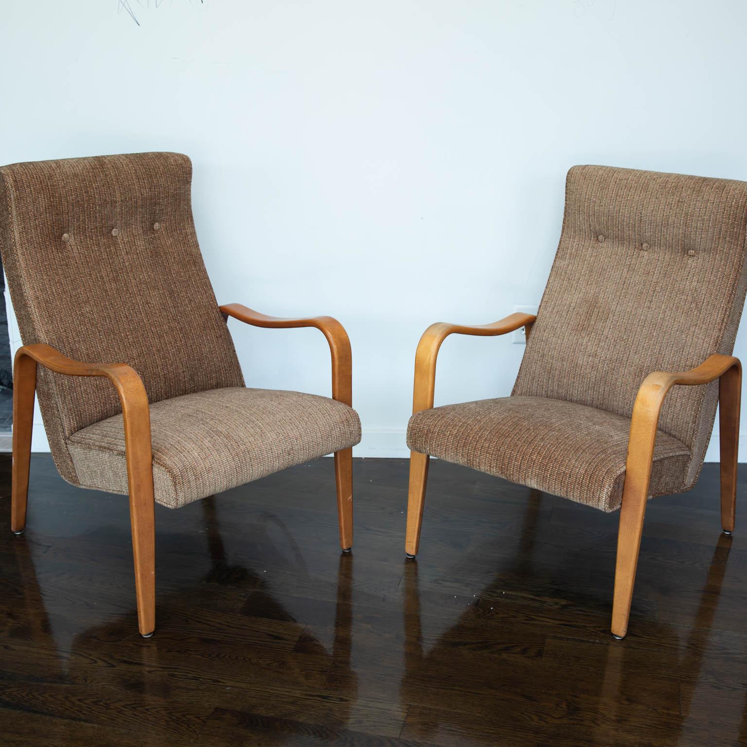 Fresh from an HBO movie about the life of Joe Paterno starring Al Pacino, this pair mid-century modern era tall back armchairs are in great original condition and have just been recovered in a brown, two toned chenile fabric.
