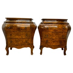 Used Pair of three draw bombe commodes marked Italy with a maple burled veneer