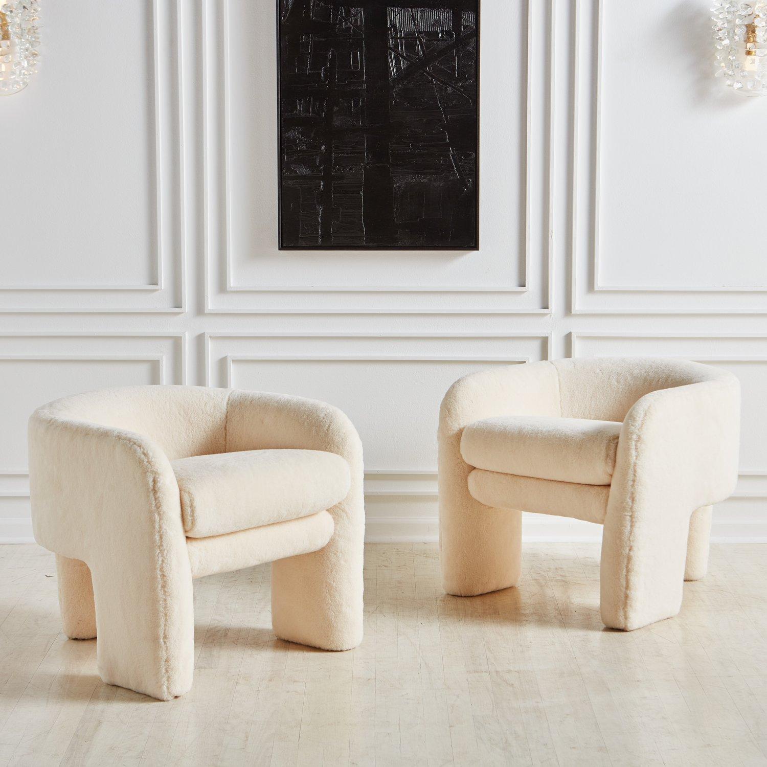 A pair of sculptural lounge chairs attributed to Vladimir Kagan for Preview Furniture. These stunning three-legged chairs feature elegant curvature and make the most of negative space, offering a remarkable perspective from every angle. Freshly