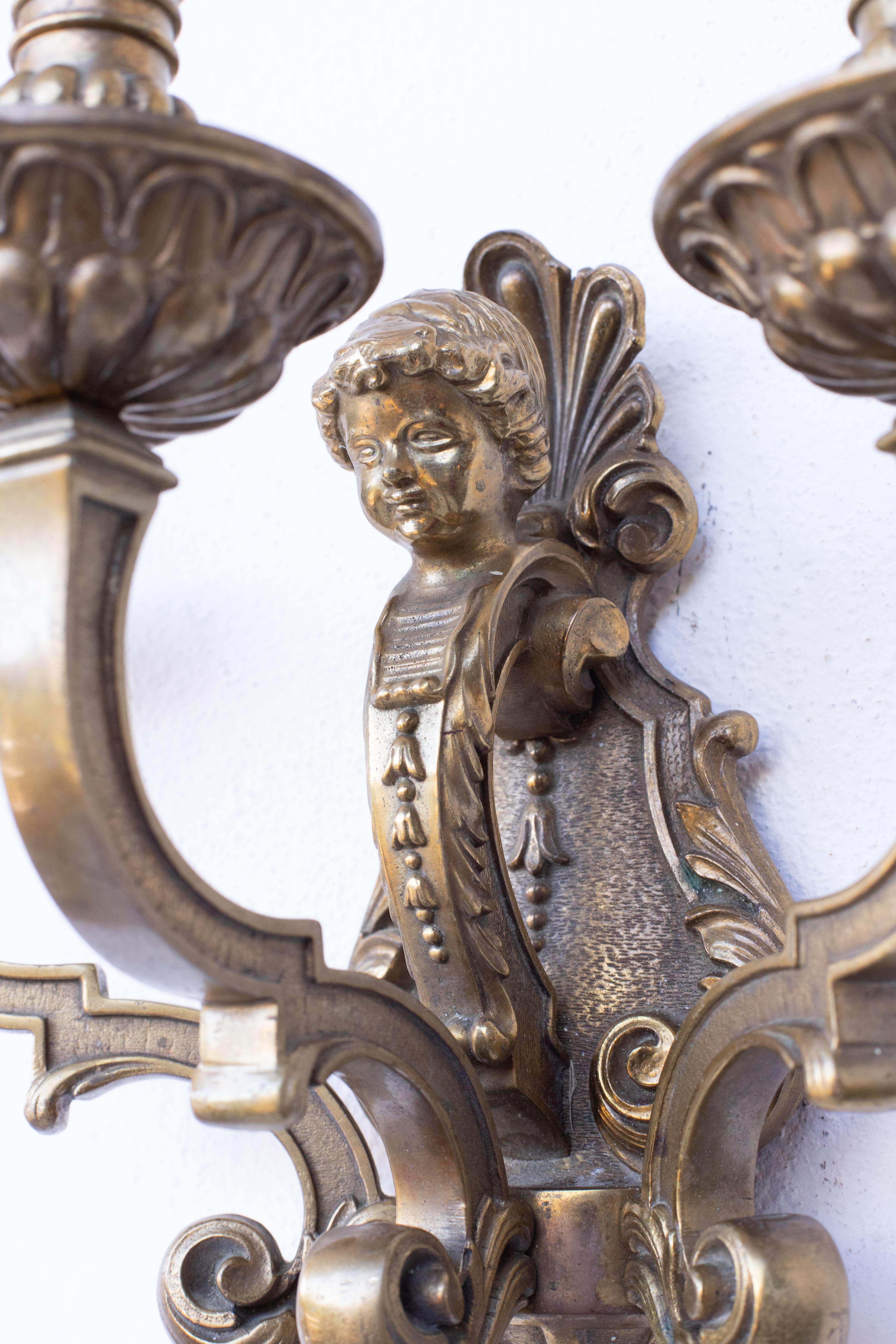 Brass Pair of three-light sconces in the Louis XVI style For Sale
