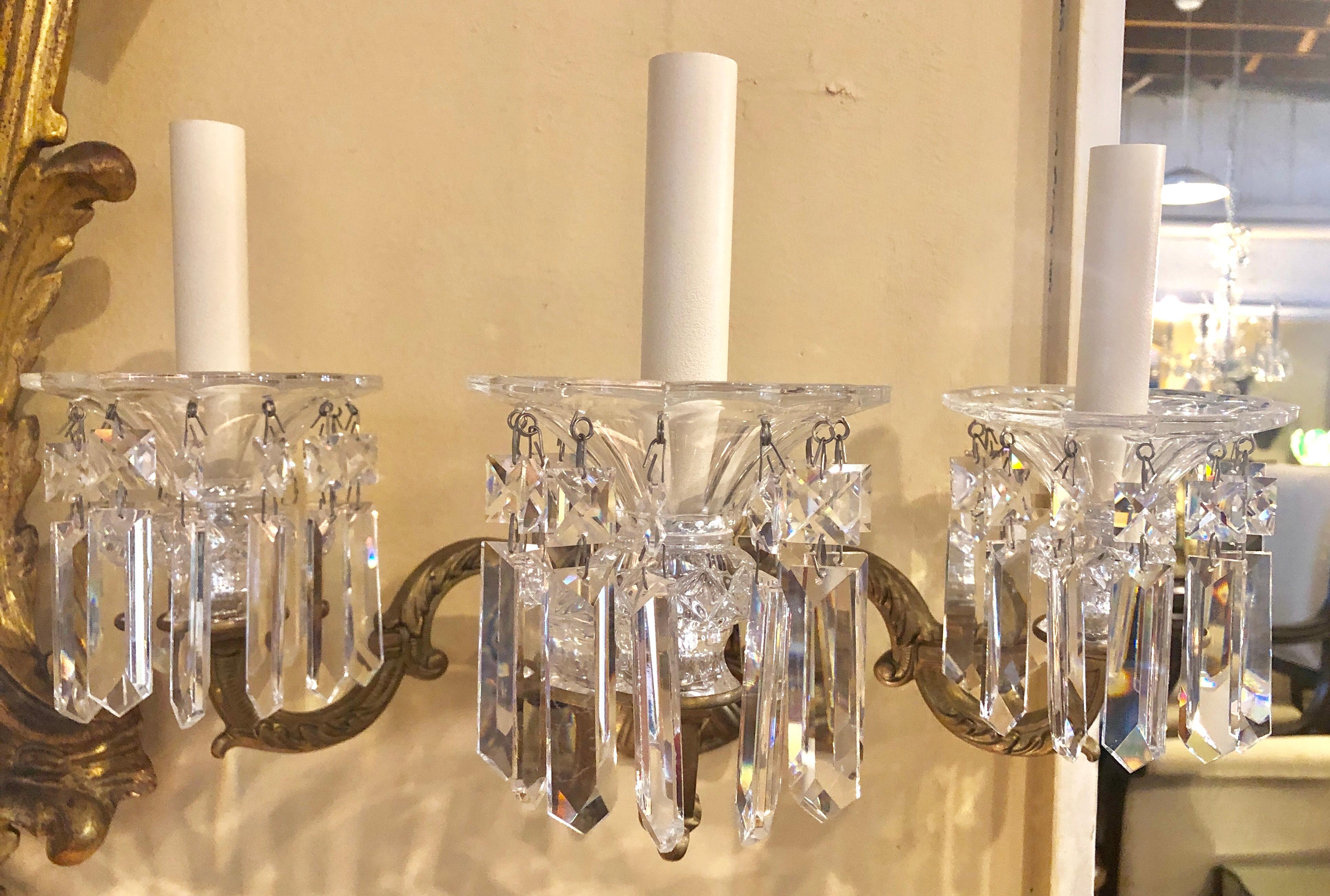 Pair of three-light solid brass sconces handcut crystals by Schonbek.