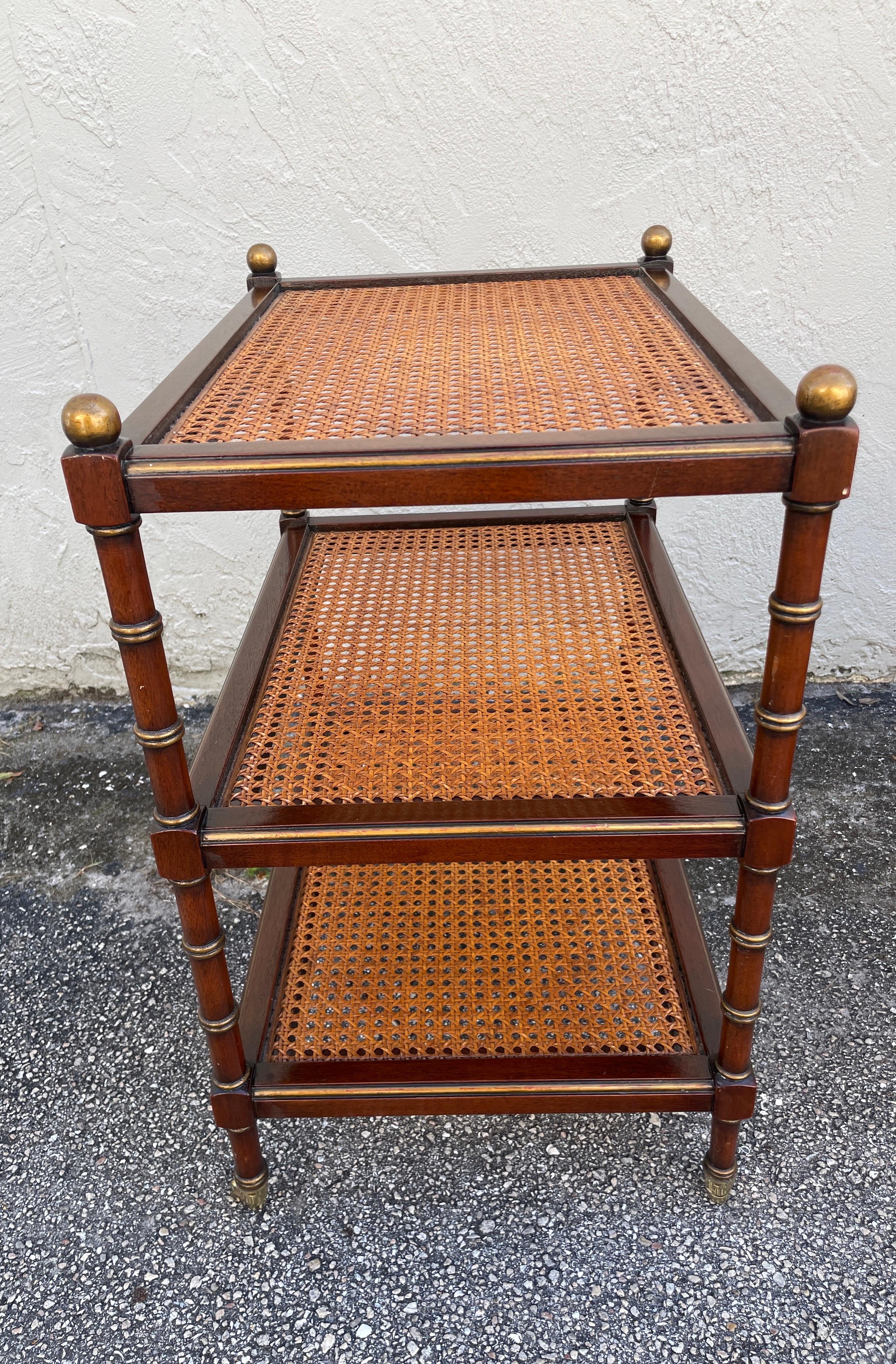 Pair of Three Tier Caned Faux Bamboo Side Tables on Casters In Good Condition In West Palm Beach, FL