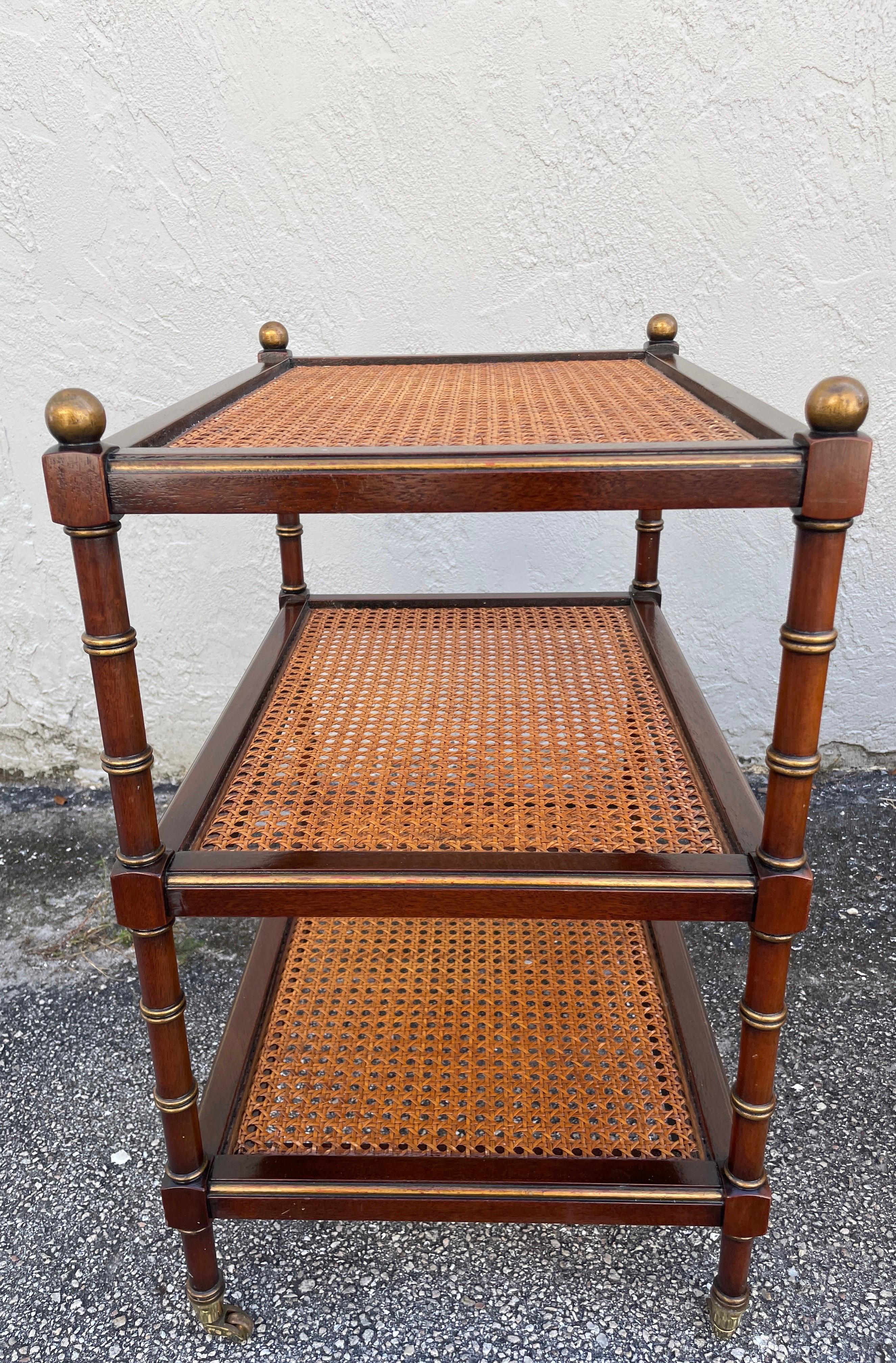 Brass Pair of Three Tier Caned Faux Bamboo Side Tables on Casters