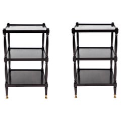 Pair of Three-Tiered Black Painted Tables on Casters