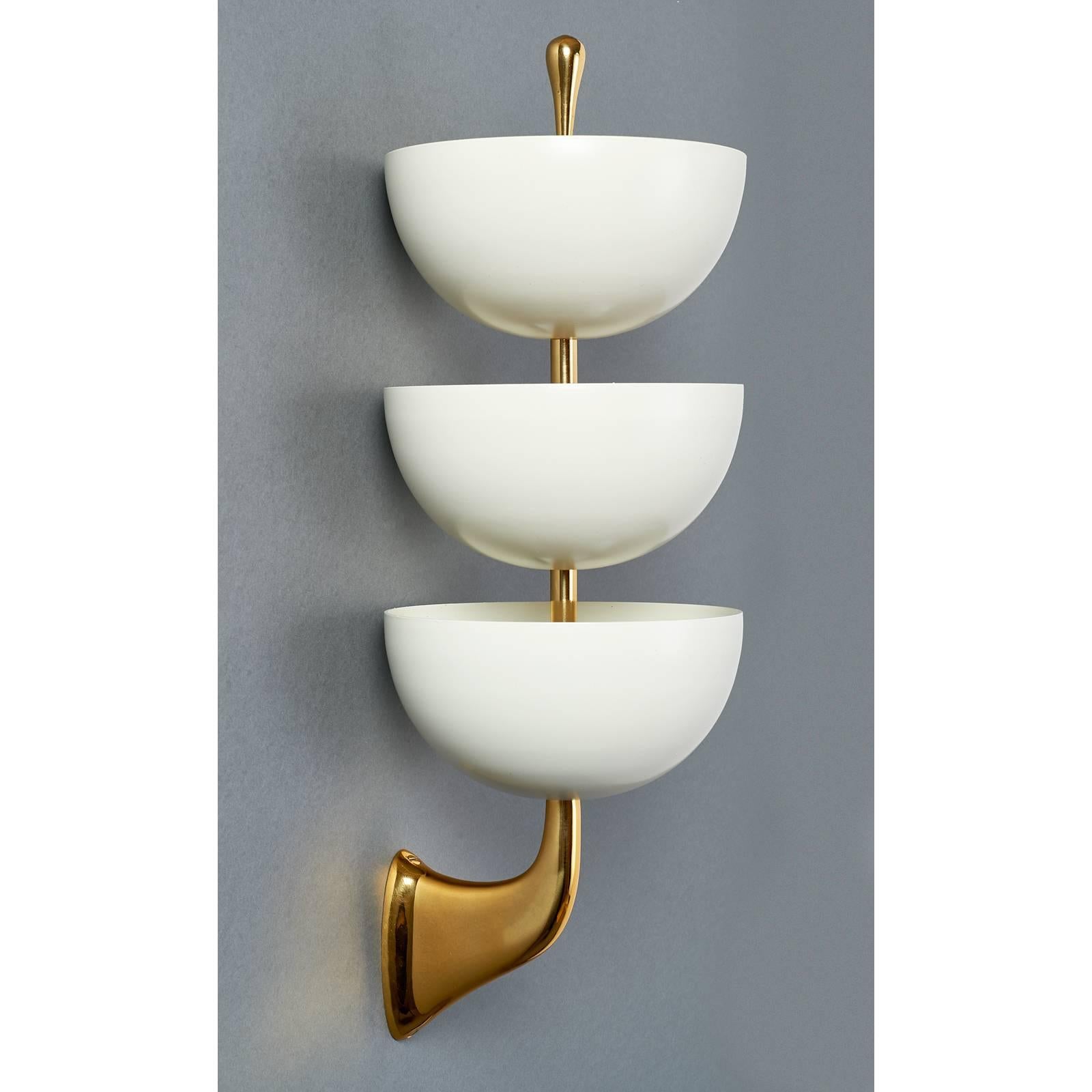 Stilnovo
Pair of three-tiered enameled metal sconces by Stilnovo with sculpted polished brass mounts.
Italy, 1950s, signed.
Rewired for use in the USA with three small chandelier base bulbs in each cup. Wall plate size for American box