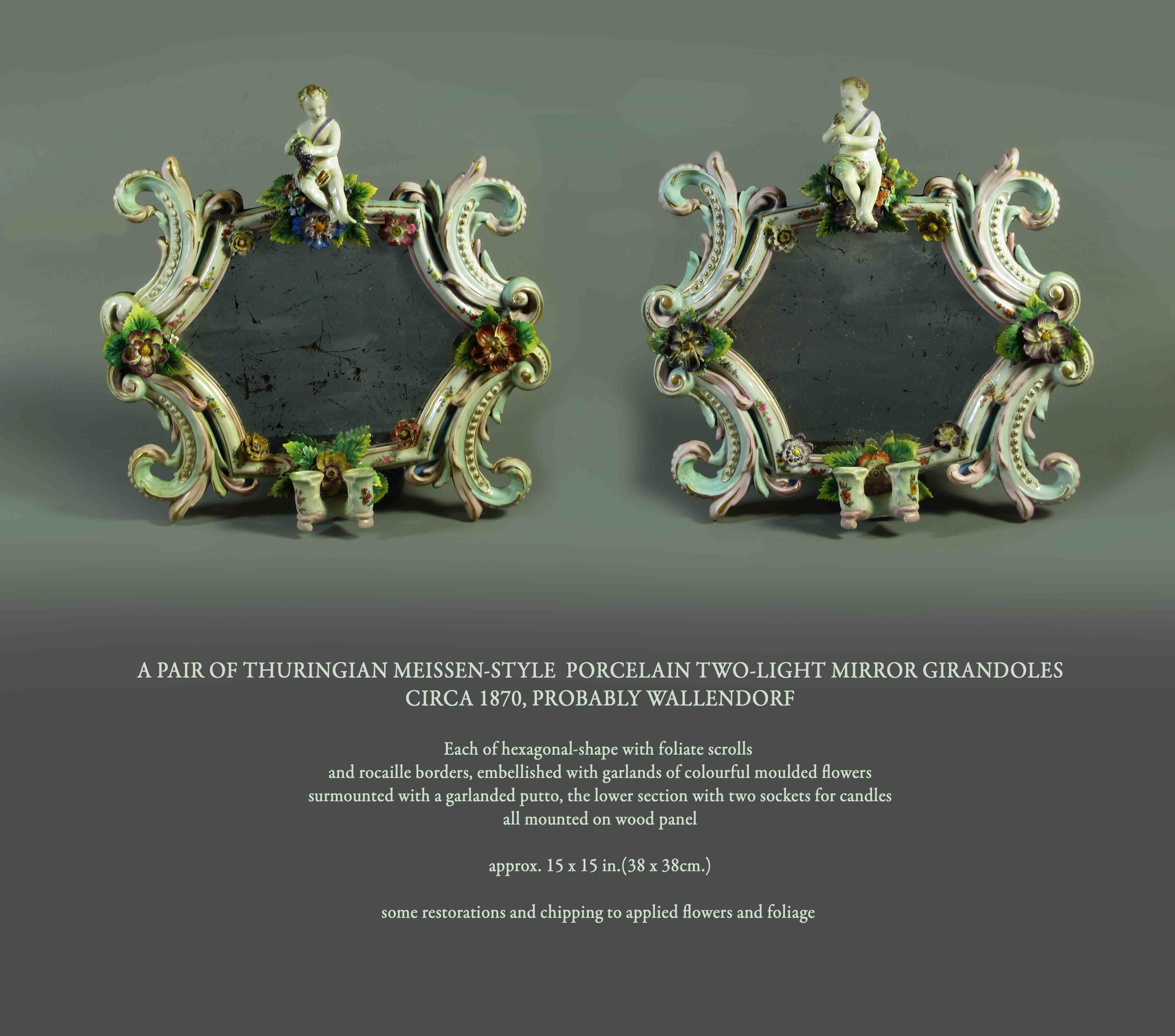 A pair of Thuringian Meissen-style porcelain two-light mirror Girandoles
Circa 1870, probably Wallendorf

Each of hexagonal-shape with foliate scrolls 
and rocaille borders, embellished with garlands of colourful moulded flowers
surmounted with