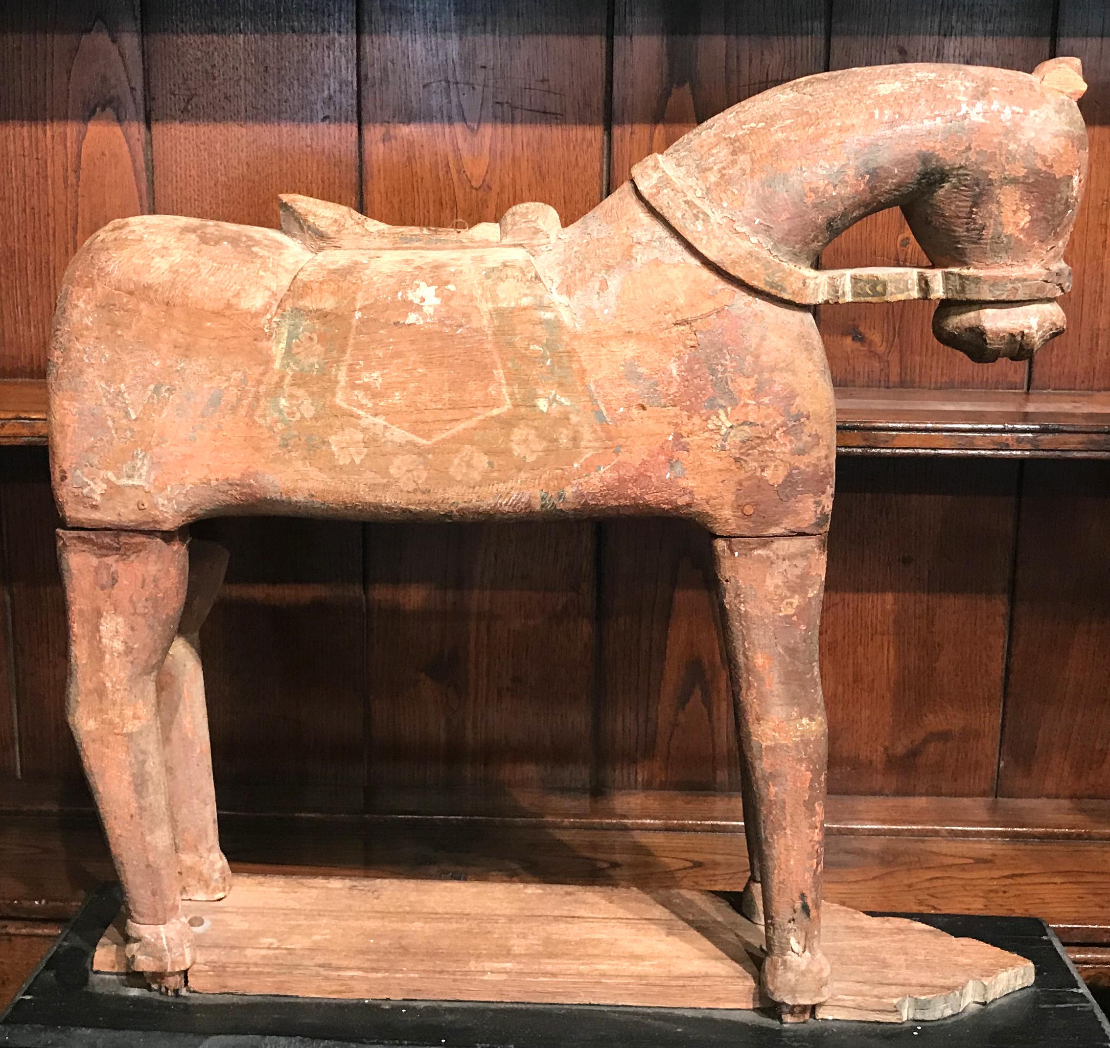 A fine pair of wooden horse elements with polychrome painted decoration, mounted on ebonized wooden plinths with molded panels. Probably Tibetan in origin and dating to the 18th or 19th century. In good overall condition, with high point minor