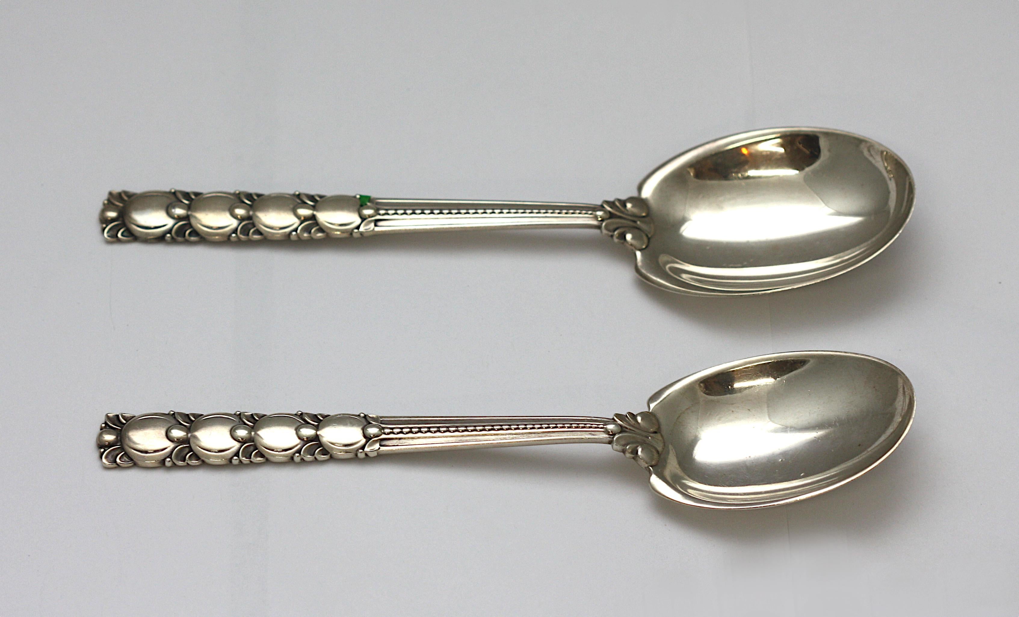 
Pair of Tiffany & C0. Sterling Silver Serving Spoons
Marked, Tiffany & Co, Sterling. In the Tomato / Exhibition pattern. The handle cast with graduating stylized circular and bead motifs. Length 10 in (25.4 cm.), 8.75 ozt.