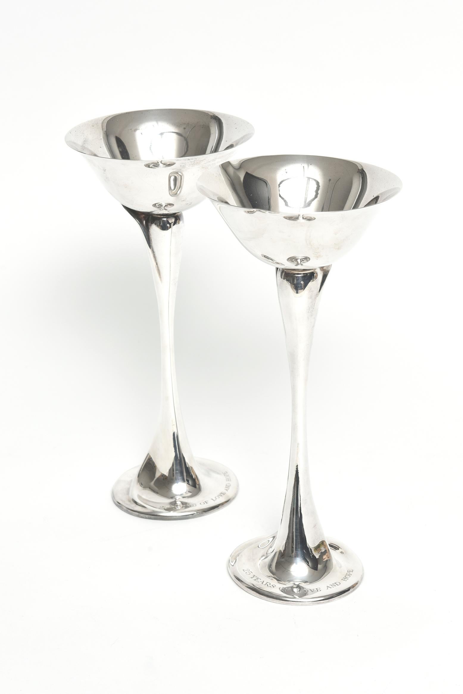 Elsa Peretti champagne glass. Sterling silver, 5-ounce bowl. Original designs copyrighted by Elsa Peretti. The retail on Tiffany's site is $1,250 per cup. These are a contemporary flower form design, each with an inverted bell-form bowl and shaped