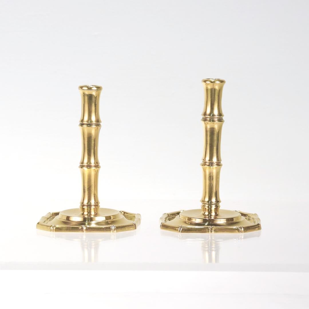A fine pair of Tiffany & Co. candlesticks.

In gilt sterling silver.

In the Bamboo pattern.

Each with a bamboo-rimmed foot and a trompe l'oeil bamboo form shaft.

Marked to the base Tiffany & Co. / Makers / Sterling / 23935.

Simply iconic Tiffany