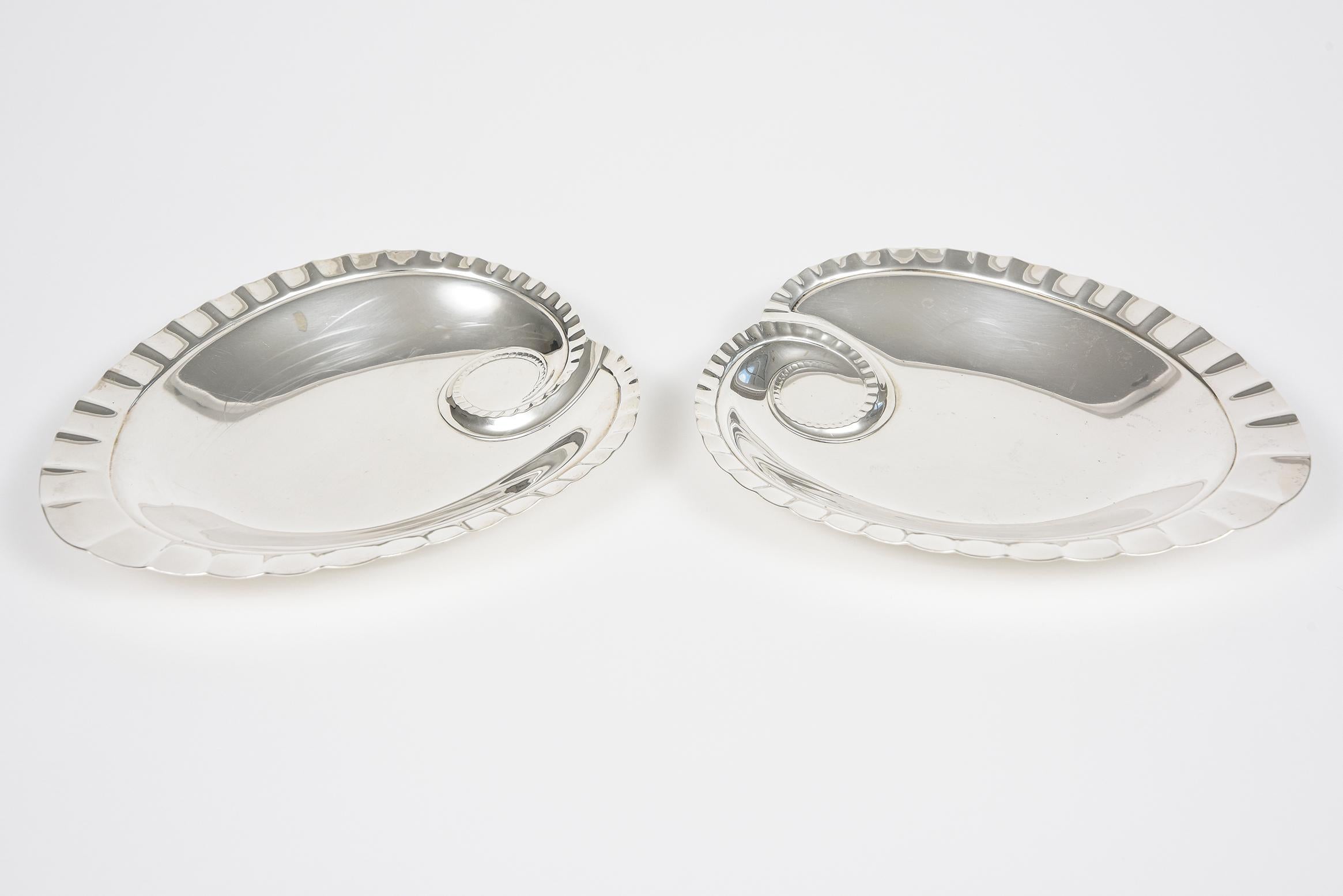 Pair of Tiffany & Co Makers sterling silver heart shaped candy dishes. They are both stamped Tiffany & Co Makers sterling and have an item number as well. Perfect for Valentine's Day, a wedding, anniversary or just to let someone know you love them.