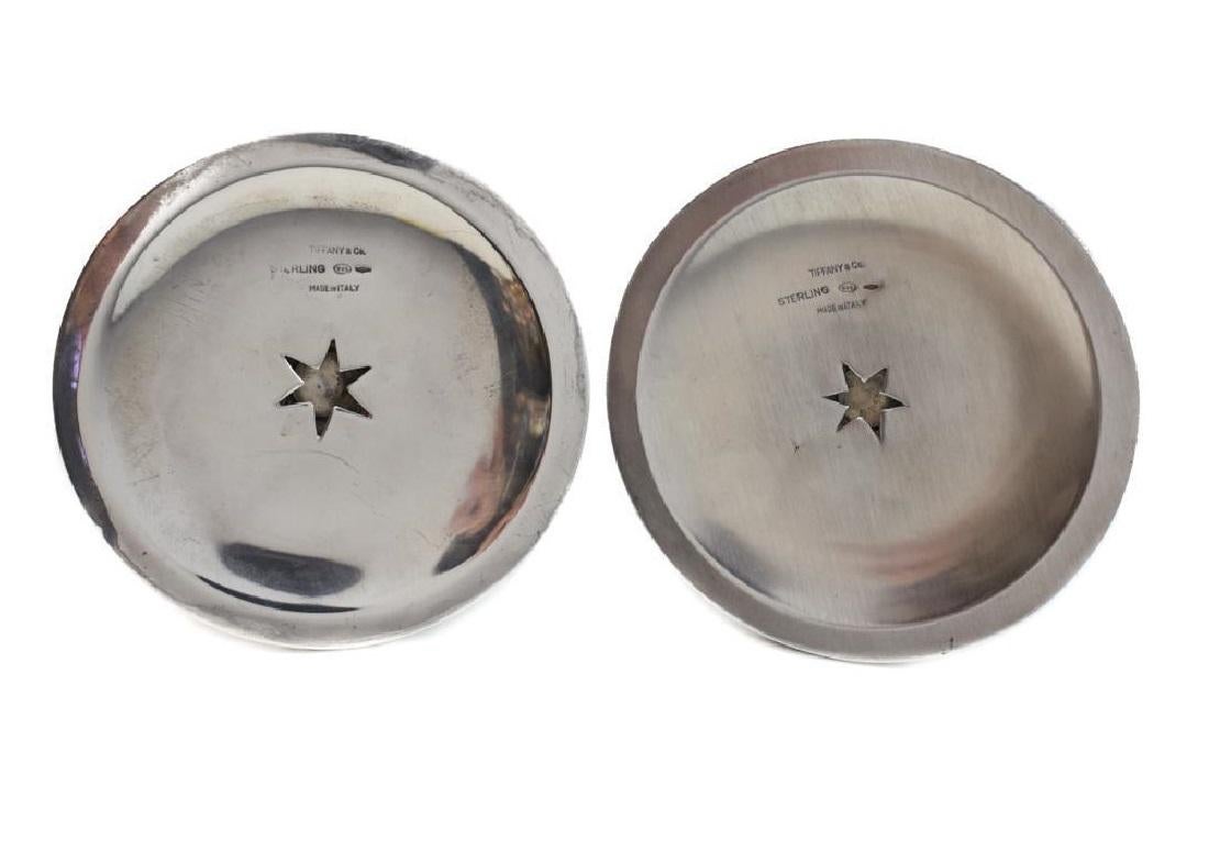 A heavy sterling silver cast pair of candleholders by De Vecchi Gabriele, Milano for Tiffany & Co. Each modelled as a palm tree with angle ridged tops, the stems resembling the trunk. Circa 1970. Marked Tiffany & Co, Sterling .925, Italy, 665 MI.