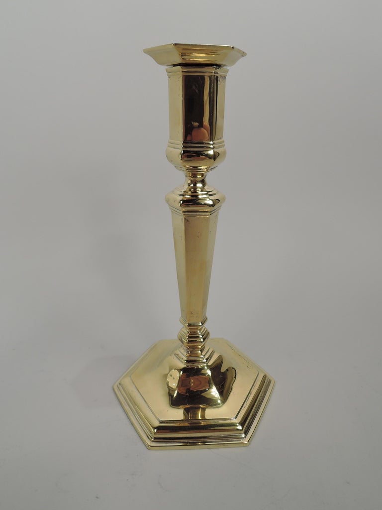 Pair of Edwardian Georgian sterling silver candlesticks. Made by Tiffany & Co. in New York, ca 1915. Each: Tapering shaft with base knop on stepped and raised foot. Socket has straight sides and detachable bobeche. Faceted. Traditional form with