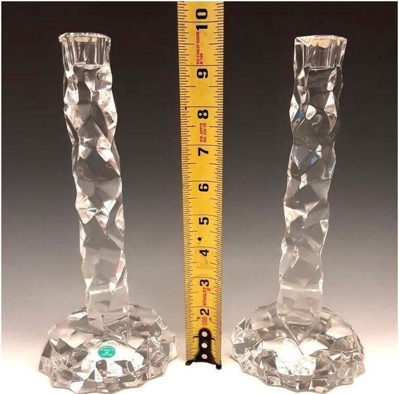 These elegant candlesticks, designed by Van Day Truex (1904-79), Head of Design for Tiffany's in the 1950s and 60’s. Inspired by nature to resemble scabrous rock crystal, the prototypes were fabricated by atelier of Archimede Seguso on the Venetian