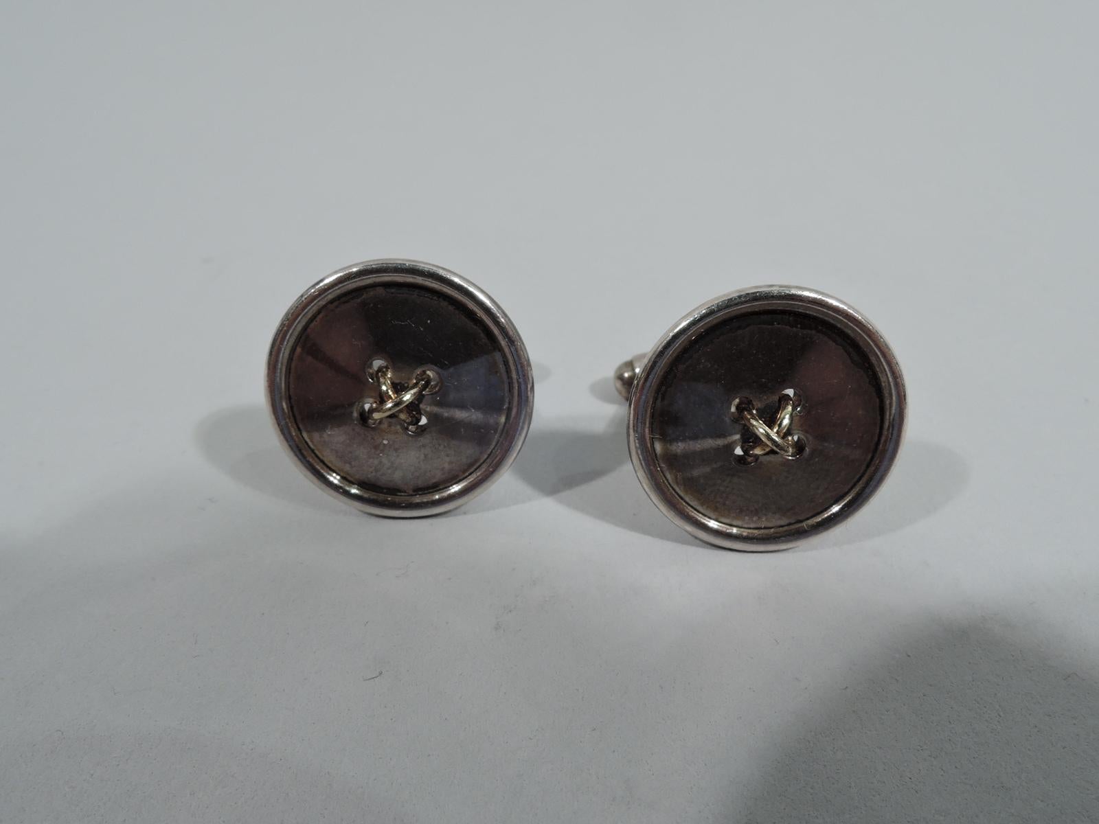 Pair of sterling silver jokey button-form cufflinks. Each: Round with 4 central holes threaded with 18k gold. Marked “Tiffany & Co. 925-750”.