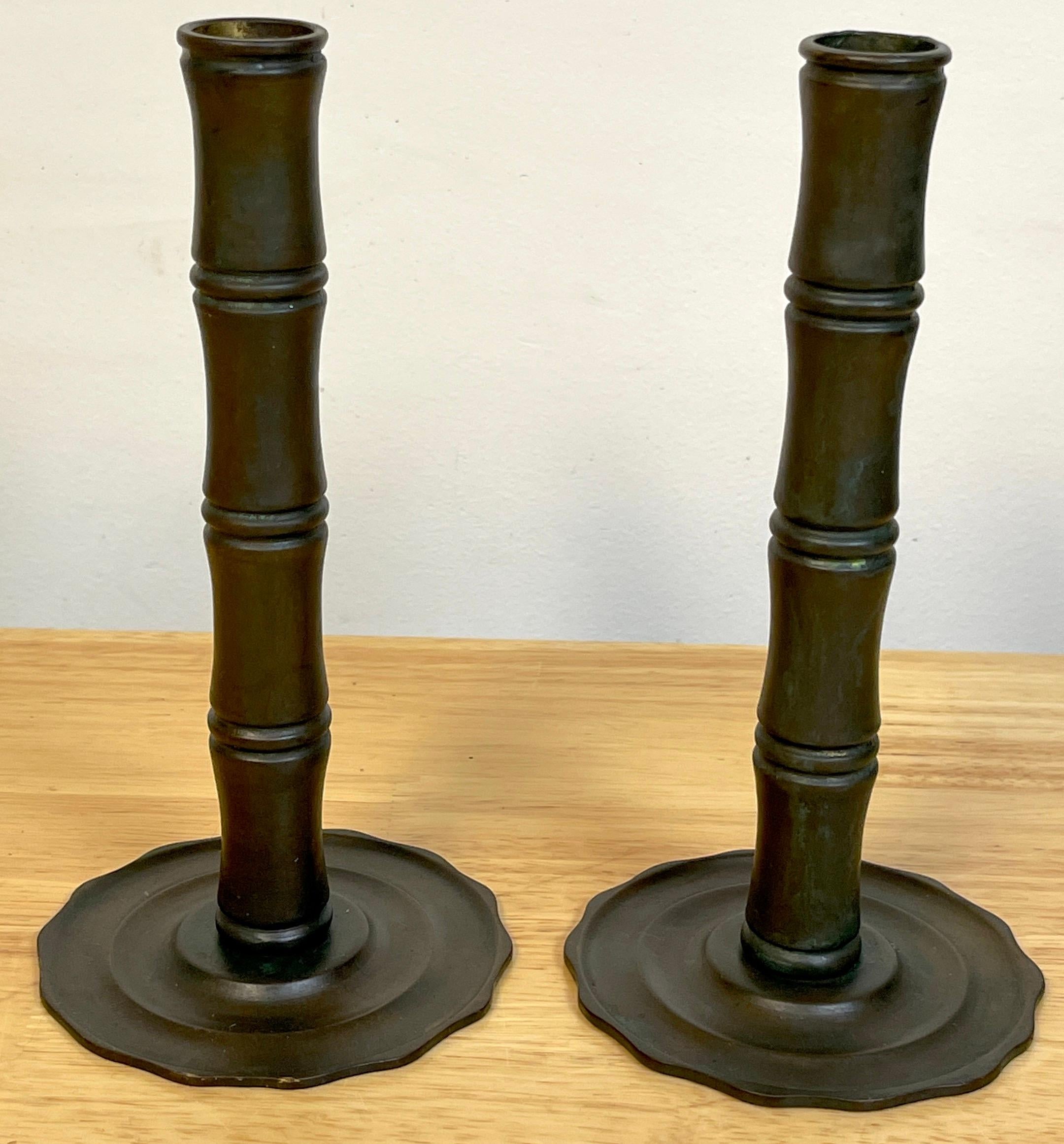 Pair of Tiffany Studios Aesthetic /Japonisme Bamboo Motif Candlesticks
A rare form, hard to find a pair of Tiffany Aesthetic /Japonisme period candlesticks. Each one with cast bamboo column candlestick with a circular scalloped tiered base. Both