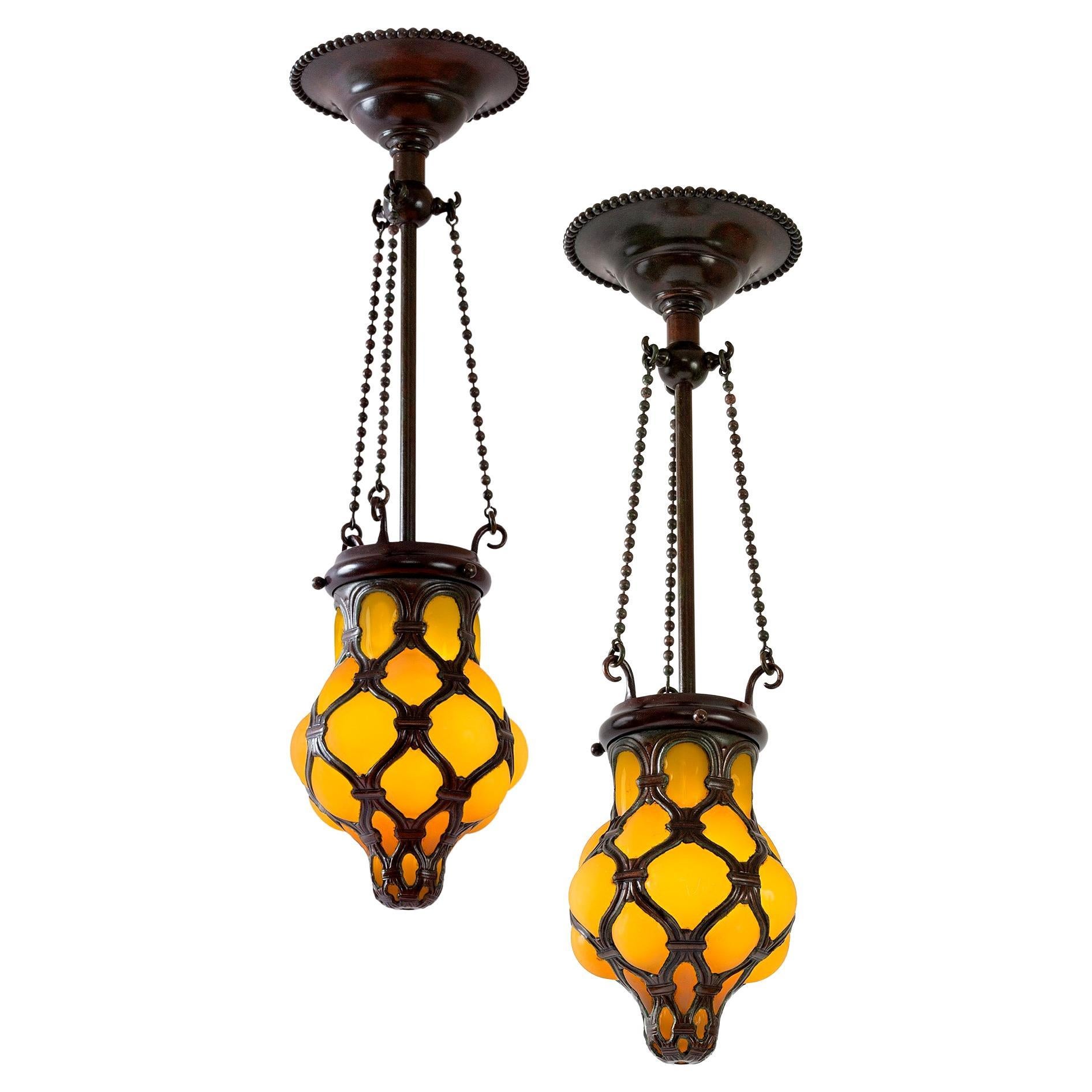 Pair of Tiffany Studios New York "Globe" Glass and Bronze Chandeliers For Sale