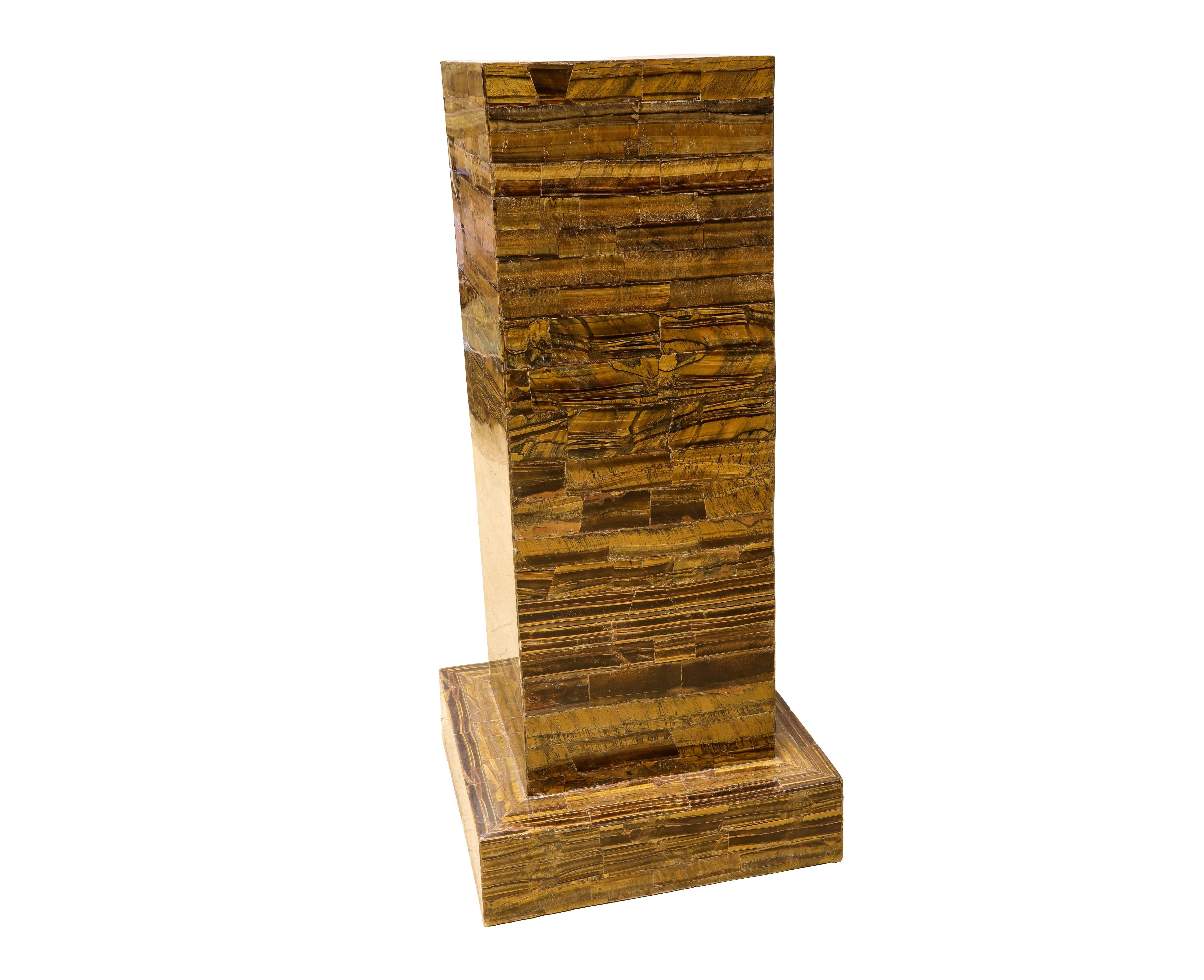 Pair of large tiger eye veneered pedestals.