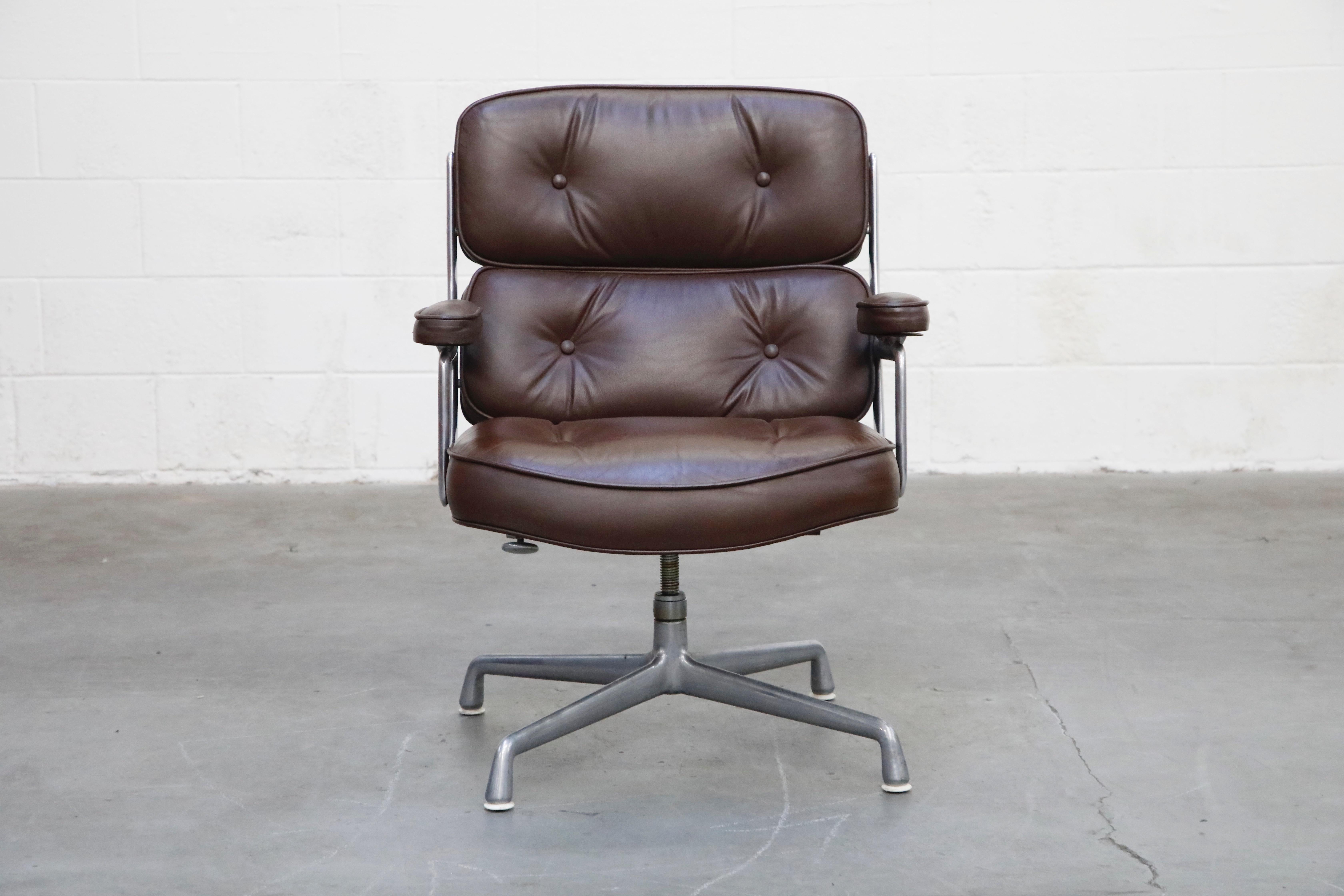 These incredible deep brown leather 'Time Life' executive swivel lounge chairs were designed by Charles and Ray Eames in 1959 and manufactured by Herman Miller. Known to be the most comfortable and ergonomic executive chair, these Time Life