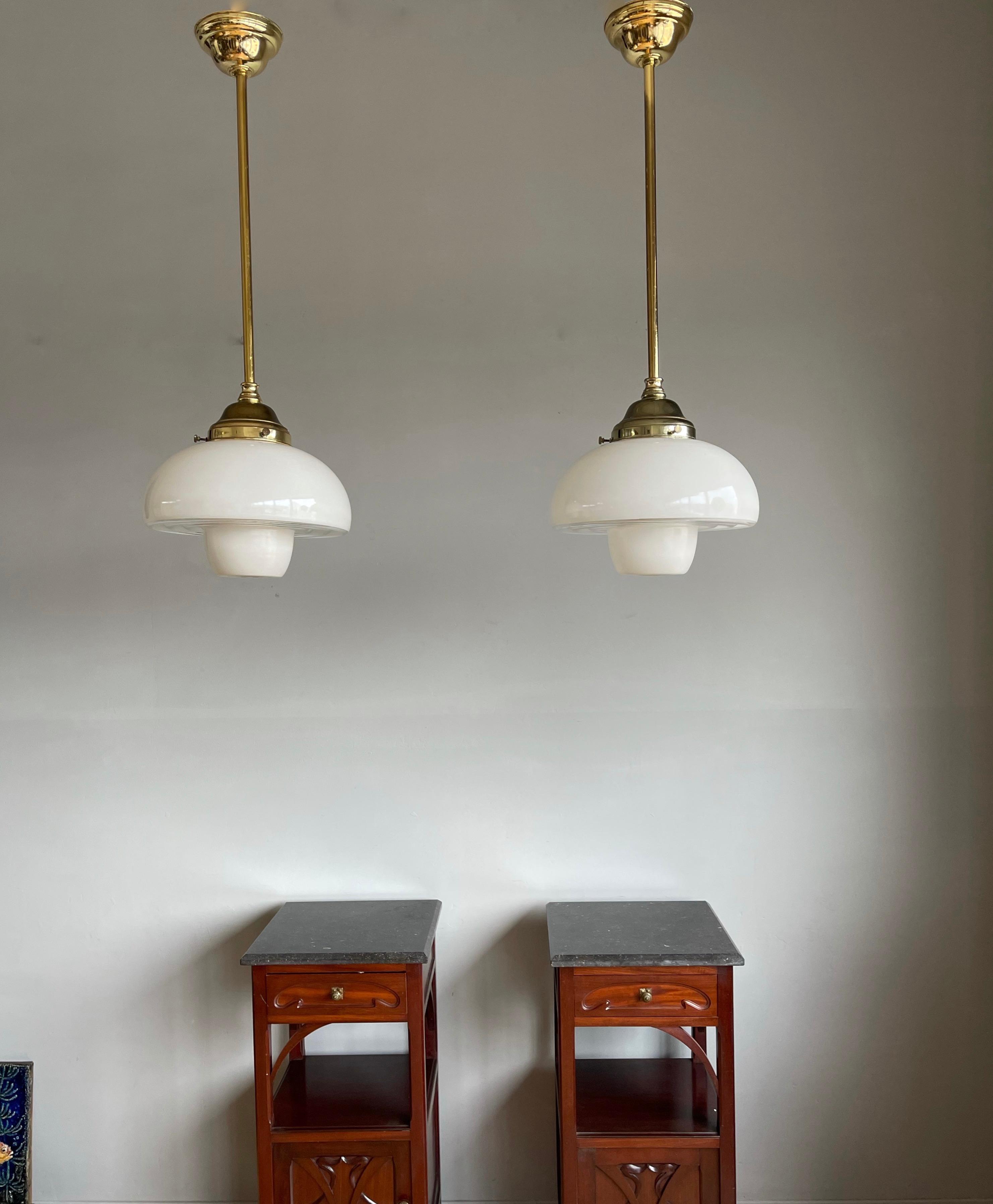 Beautiful shape and excellent condition pendants.

Finding one rare light fixture is a good thing, but finding two is always that extra bit special. So if you are looking for a beautiful pair of pendants to grace your entry hall, kitchen or bedroom
