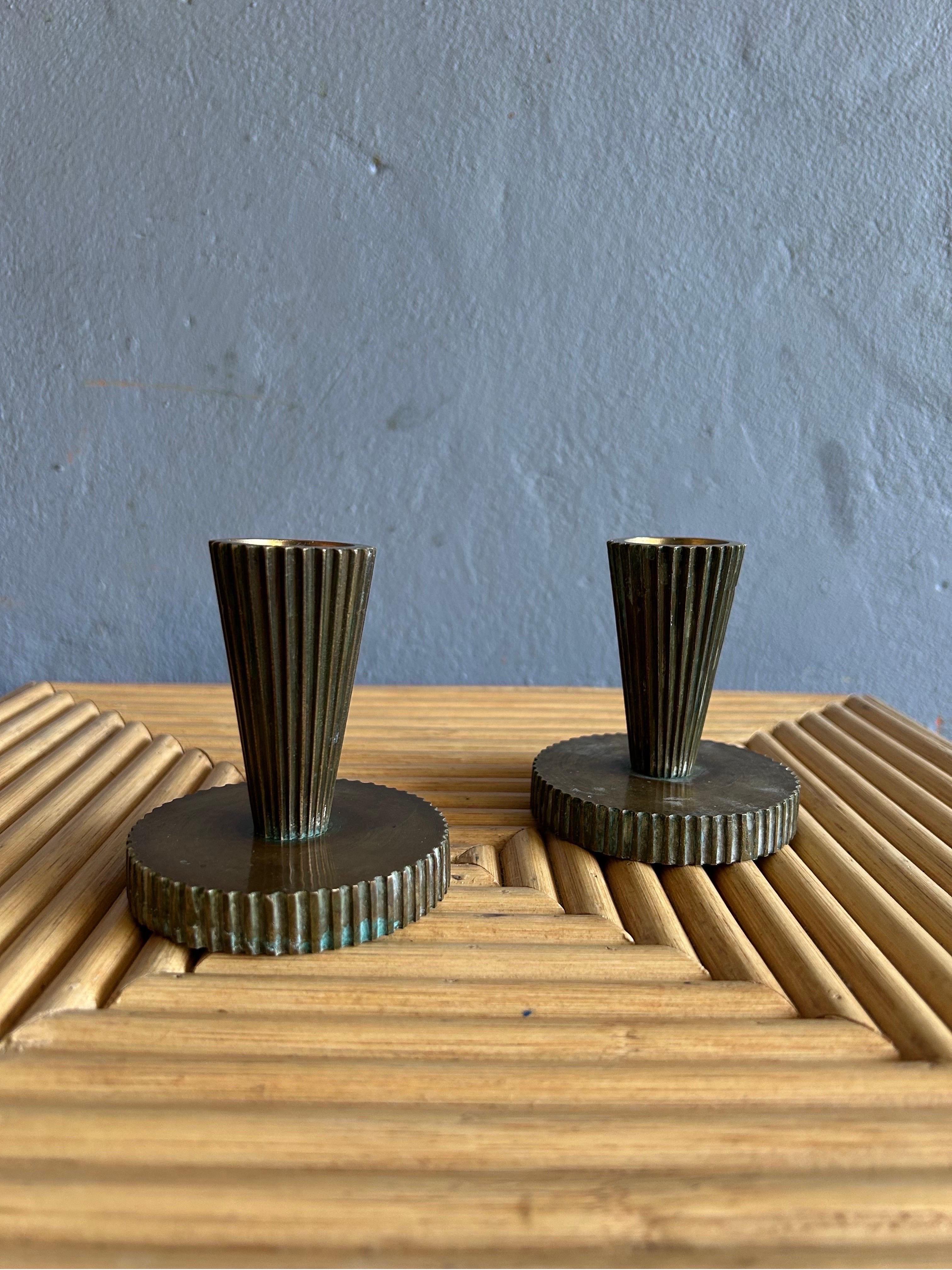 Rare pair of Tinos bronze Art Deco candle holders made in Denmark in the 1930s.


Art Deco, short for the French Arts Décoratifs, and sometimes just called Deco, is a style of visual arts, architecture, and product design, that first appeared in