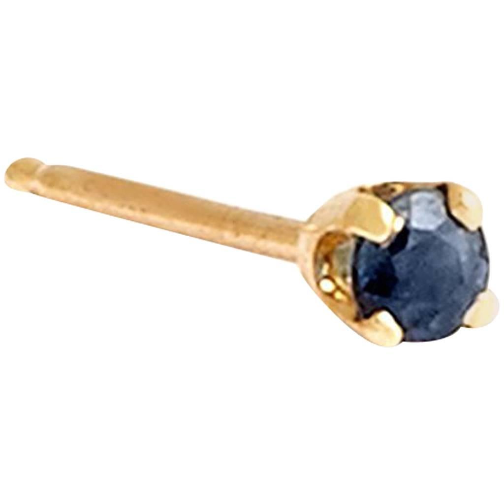 Blue sapphire studs in the tiniest size of our range of delicate stud earrings, set in 9-carat yellow gold. This listing is for a pair, each stud featuring a 0.02 carat round brilliant cut blue sapphire from Sri Lanka measuring approximately 2 mm in