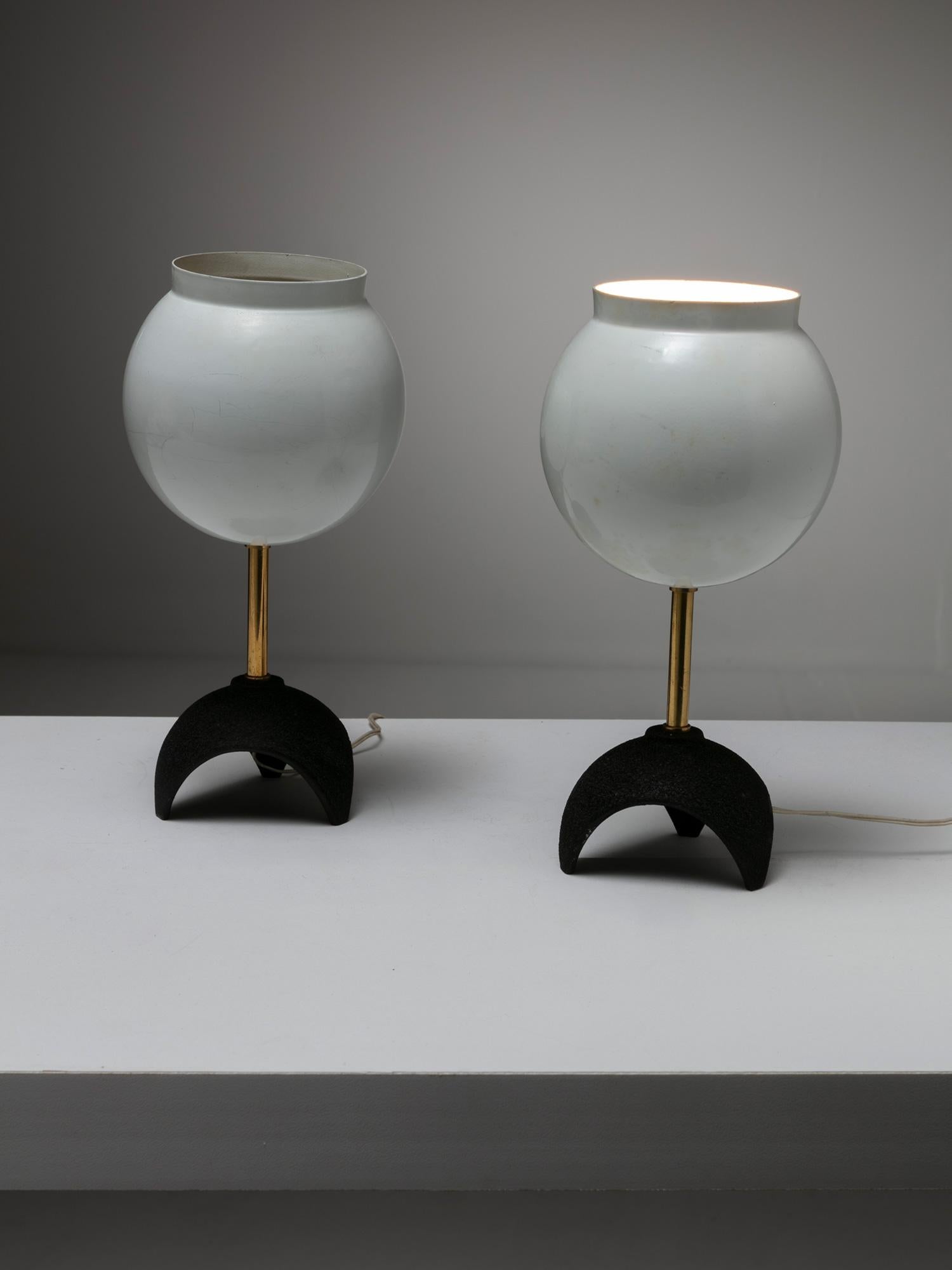Tiny flower shaped table lamps.
White lacquered shade and brass details