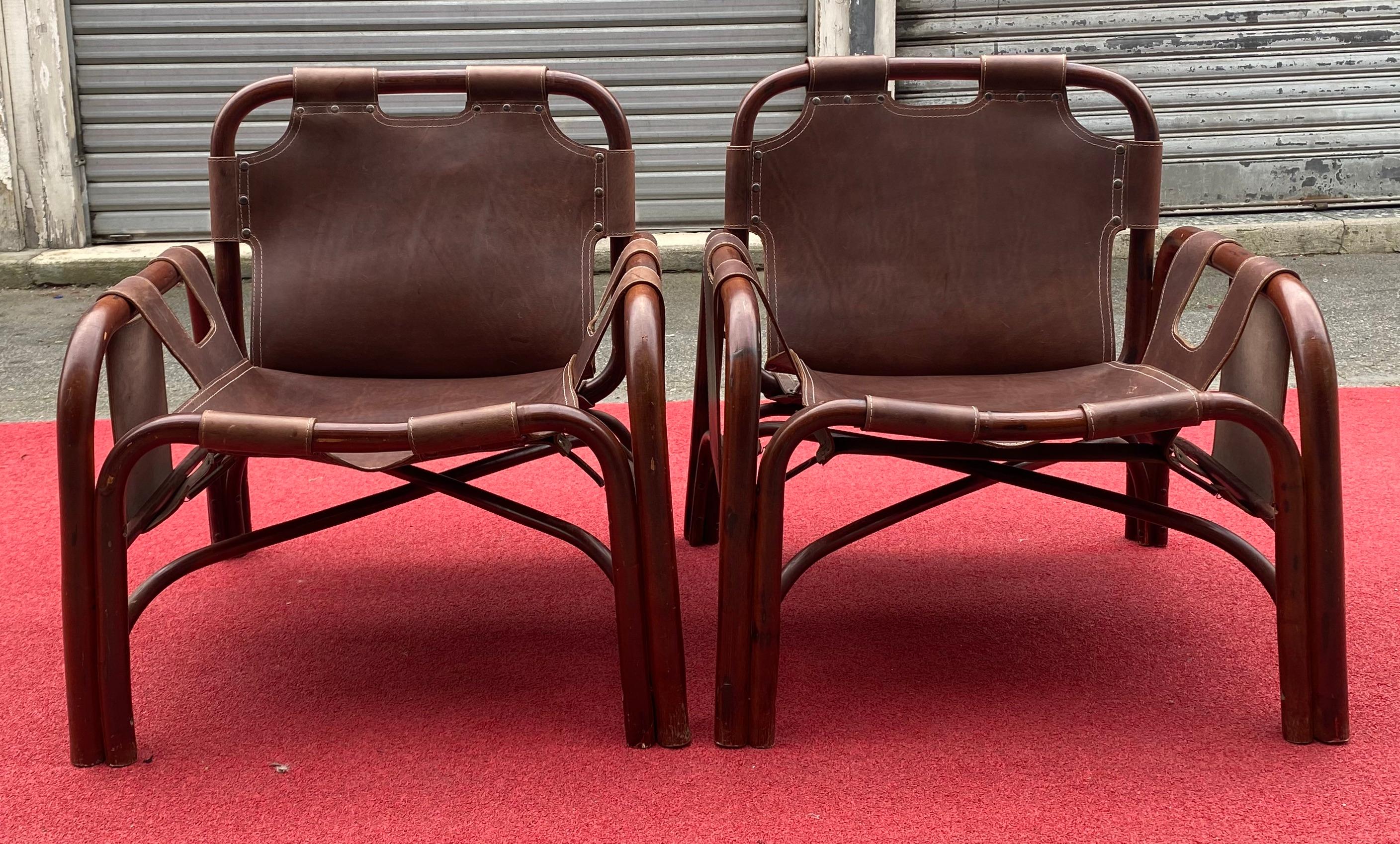 Pair of Tito Agnoli armchairs-Bonacina Edition 1960.
Bamboo frame / Seat and back in stitched and riveted leather.
Measures: L 68 x W 72 x H 70
Leather restored to new
Superb condition.
