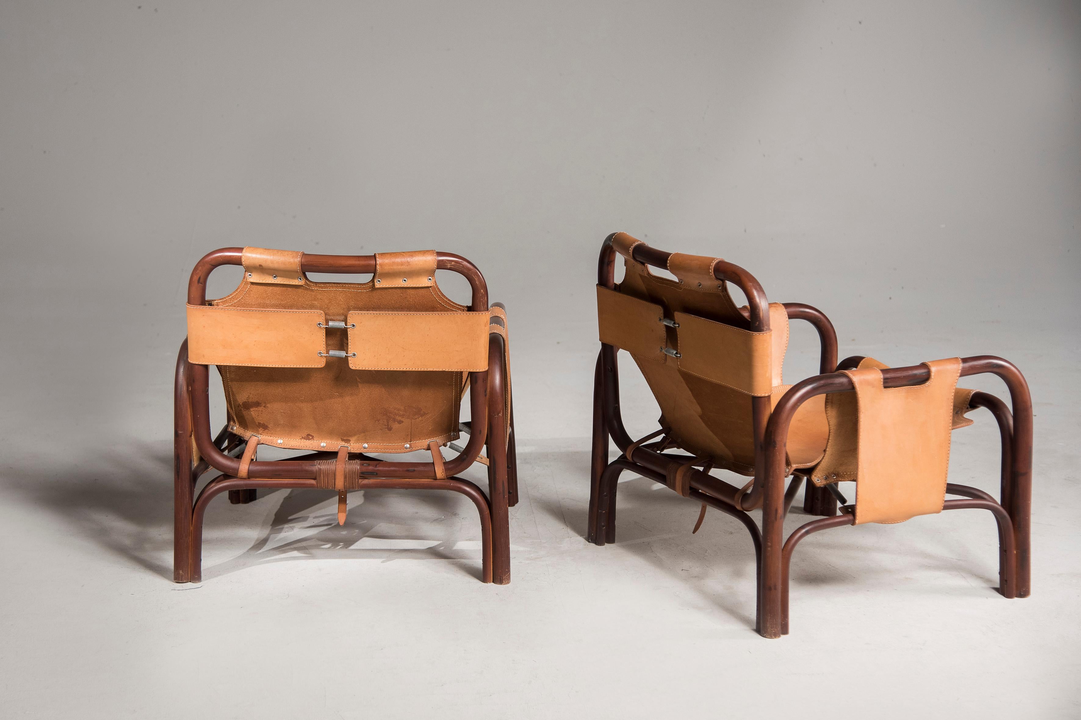 Ein Paar Tito Agnoli-Sessel aus Holz und Leder 8