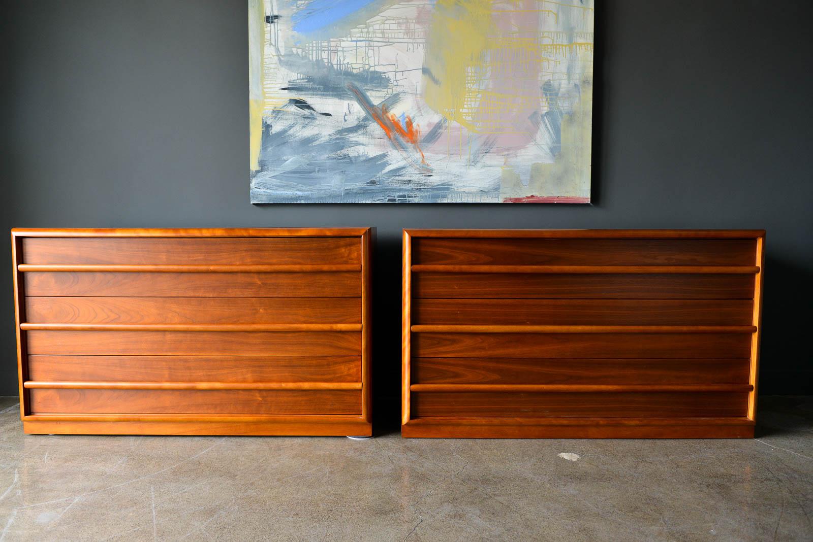 Pair of T.H. Robsjohn-Gibbings for Widdicomb Walnut Dressers, circa 1955. Beautifully and professionally stored walnut with sculpted drawer pulls and stunning walnut grain. Sold separately, these dressers can be used as a single, or pushed together