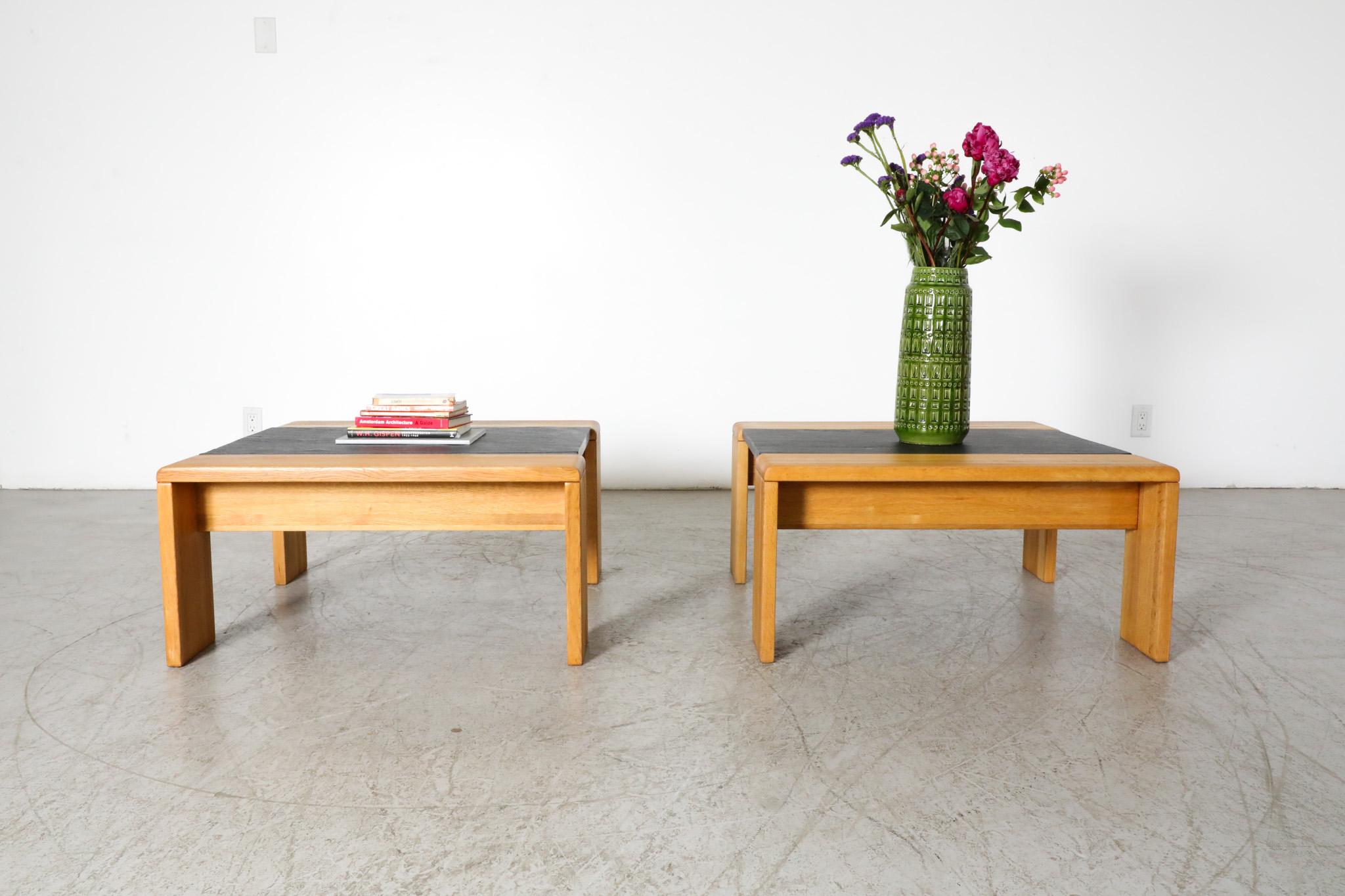 Pair of Mid-Century oak and stone side tables manufactured by dutch furniture maker Leolux. Echoes the work of Italy's Tobia Scarpa. These tables feature oak wood frames with inset slate stone tops resulting in a beautiful pairing of complementary