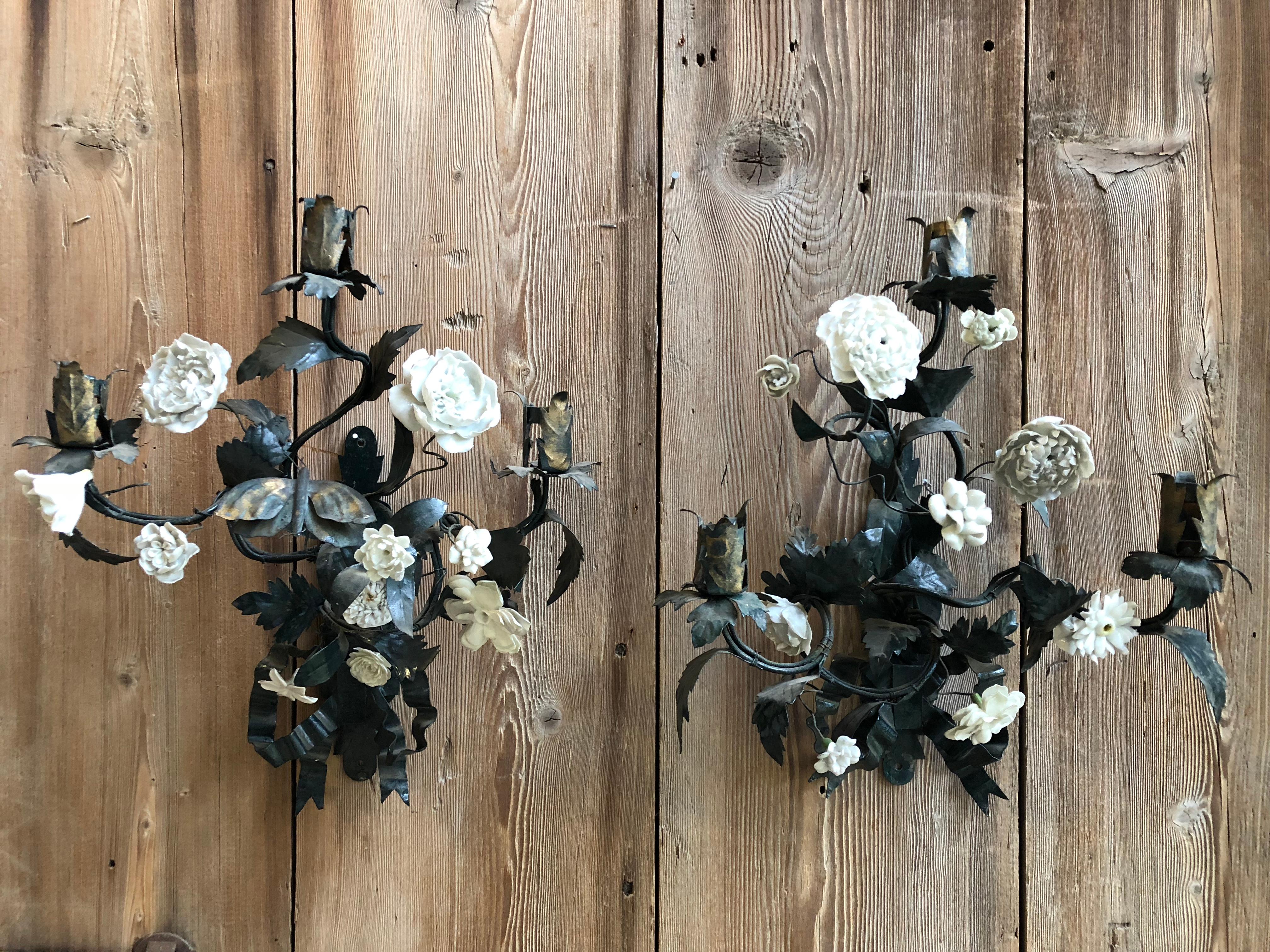 A charming pair of painted tole and white bisque porcelain floral sconces, each with 3 arms, Italian, 1940s.
