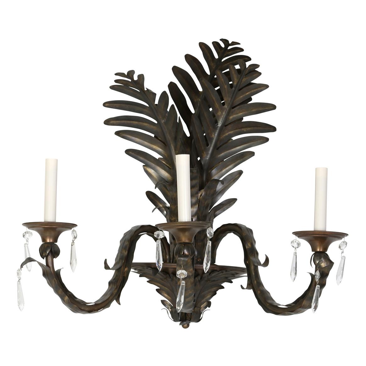 A pair of tole metal tall palm frond sconces with three lights and crystal drops.  Each light max 25 watts.  Provenance sale at Christie's