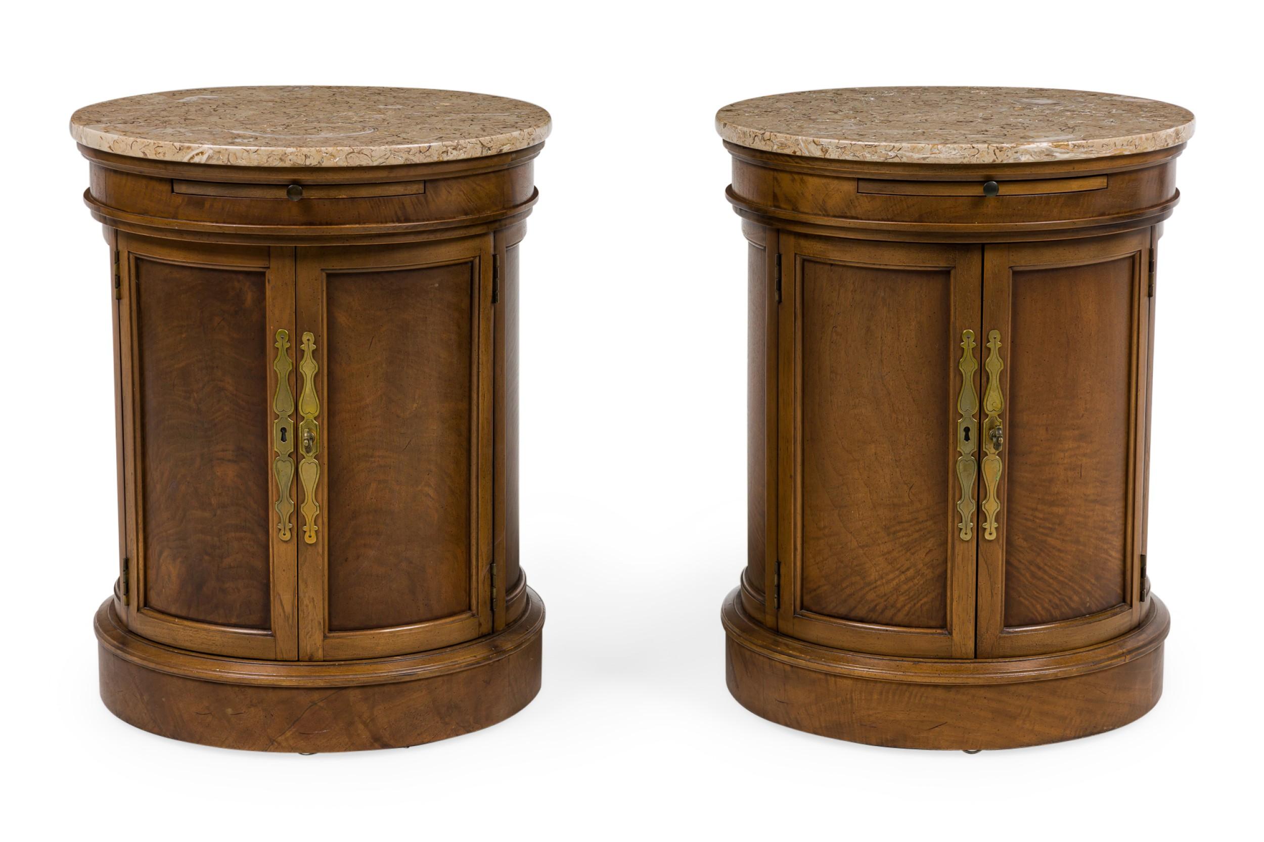 PAIR of American Mid-Century round drum shaped 2-door burlwood side tables opening to a single interior shelf with brass escutcheons and a pull out hidden drawer beneath a round marble top (PRICED AS PAIR - Also Available Individually)(Has