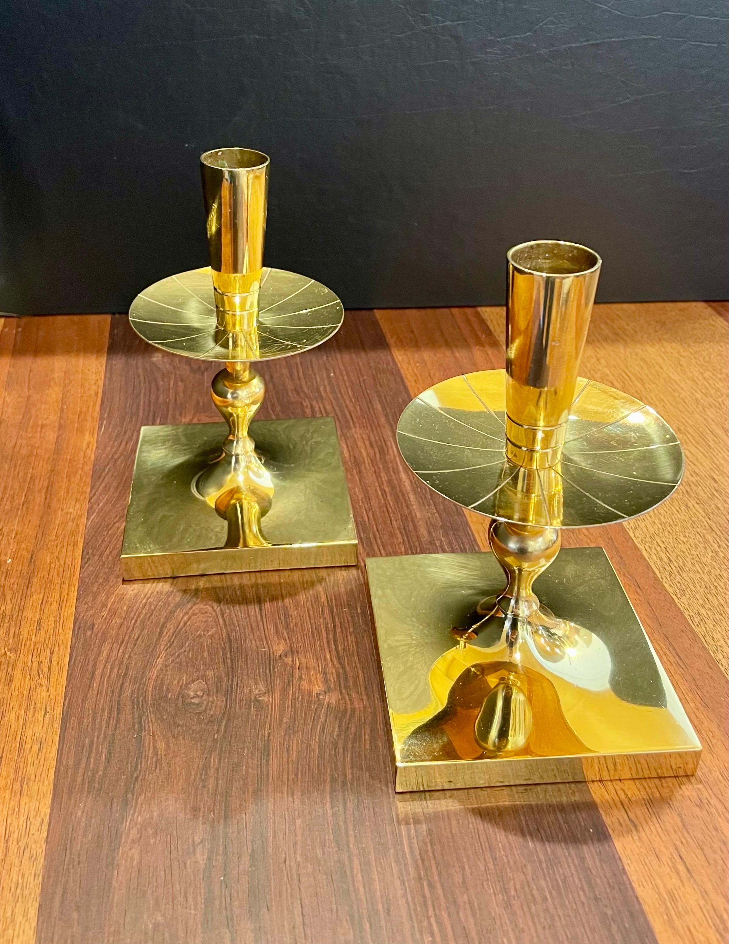 Elegant pair of Tommi Parzinger solid brass candleholders made by Dorlyn Silversmiths New York, a nice clean condition some patina.
 